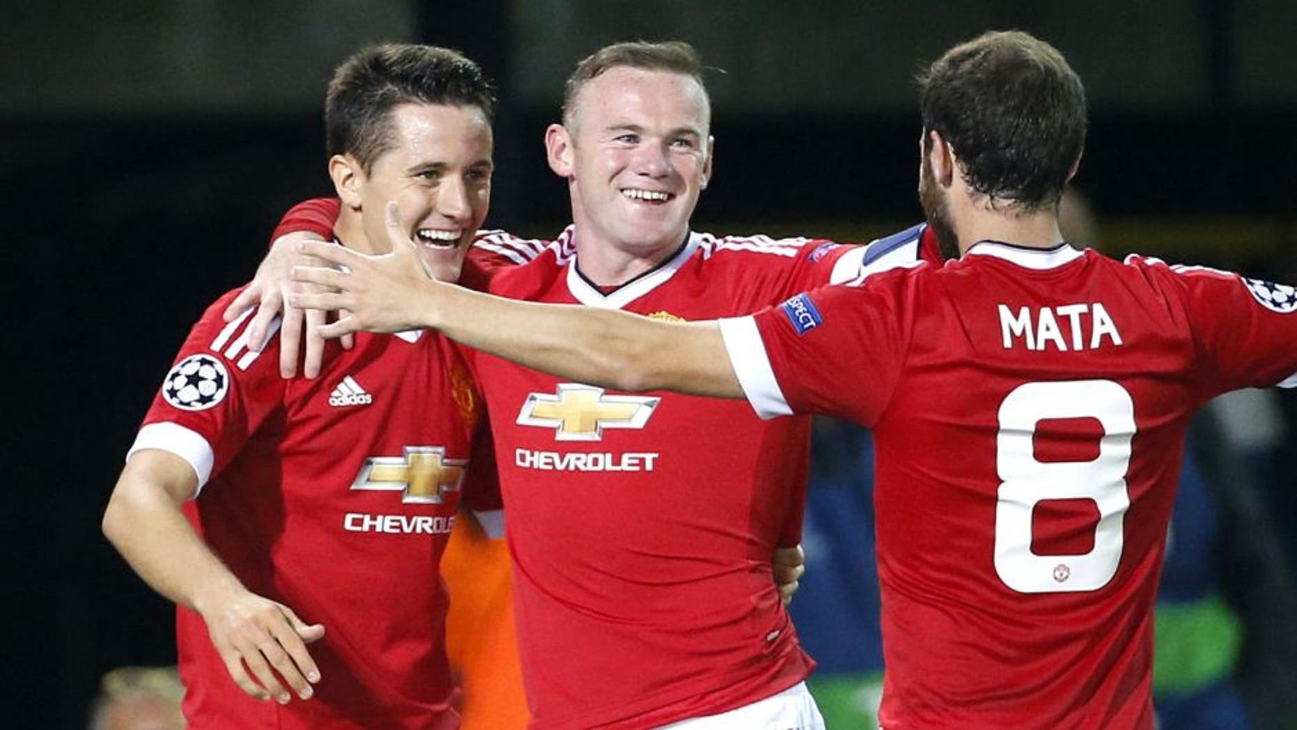 BRUGGE - AUGUST 26: Ander Herrera of Manchester United (assist) celebrates a goal by Wayne Rooney of Manchester United during the UEFA Champions League play off round 2nd leg between Club Brugge KV and Manchester United on August 26, 2015 in Brugge, Belgium. (Photo by Jean Catuffe/Getty Images)