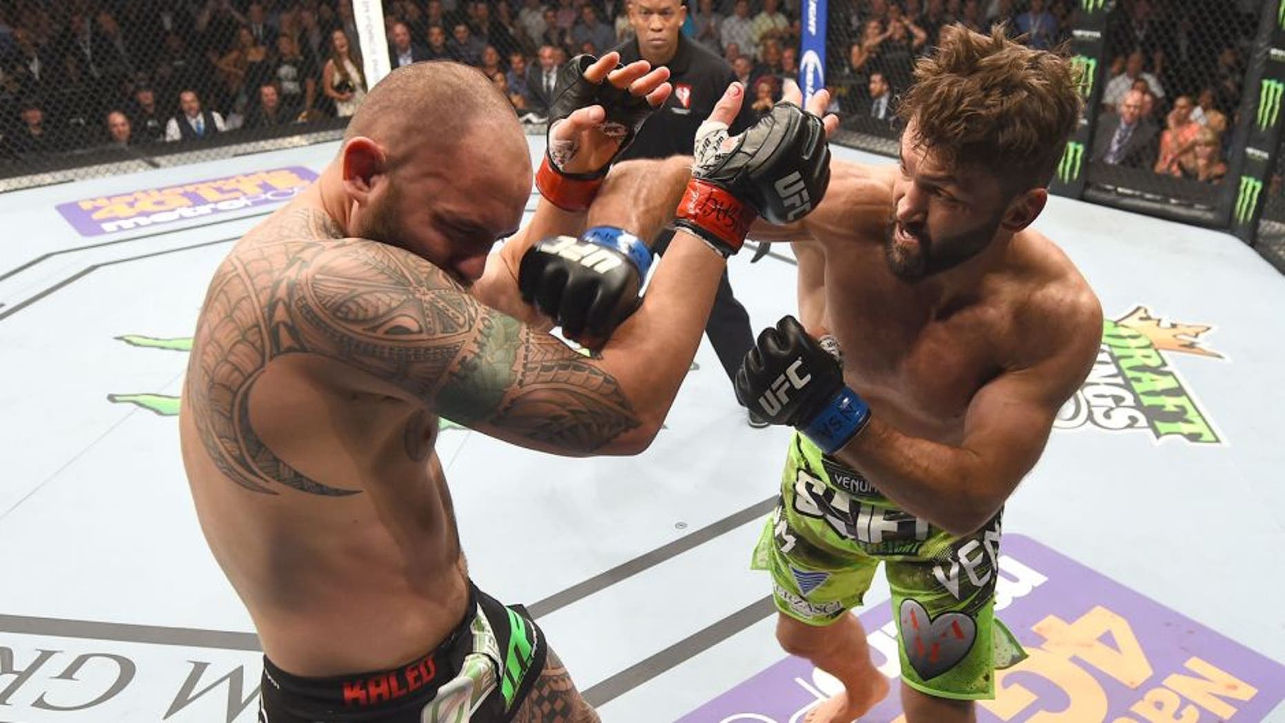 LAS VEGAS, NV - MAY 23: (R-L) Andrei Arlovski punches Travis Browne in their heavyweight bout during the UFC 187 event at the MGM Grand Garden Arena on May 23, 2015 in Las Vegas, Nevada. (Photo by Josh Hedges/Zuffa LLC/Zuffa LLC via Getty Images)