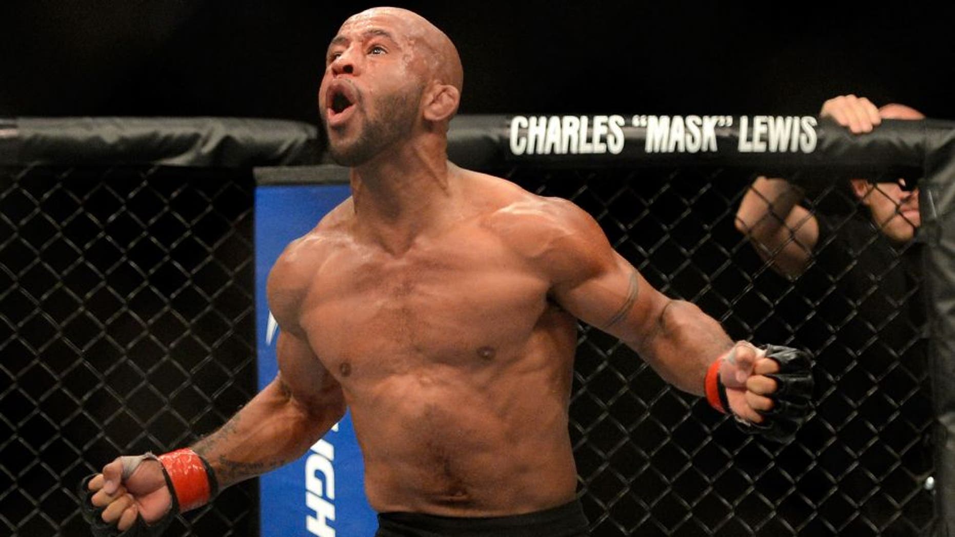 SEATTLE, WA - JULY 27: Demetrious Johnson celebrates his victory over John Moraga in their flyweight championship bout during the UFC on FOX event at Key Arena on July 27, 2013 in Seattle, Washington. (Photo by Jeff Bottari/Zuffa LLC/Zuffa LLC via Getty Images)