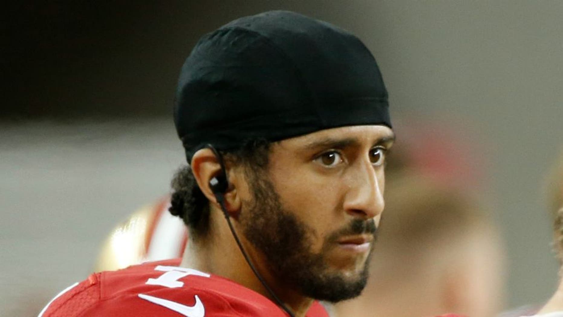 San Francisco 49ers quarterbacks Colin Kaepernick, left, and Blaine Gabbert stand on the sideline during the second half of an NFL preseason football game against the Green Bay Packers on Friday, Aug. 26, 2016, in Santa Clara, Calif. Green Bay won 21-10. (AP Photo/Tony Avelar)