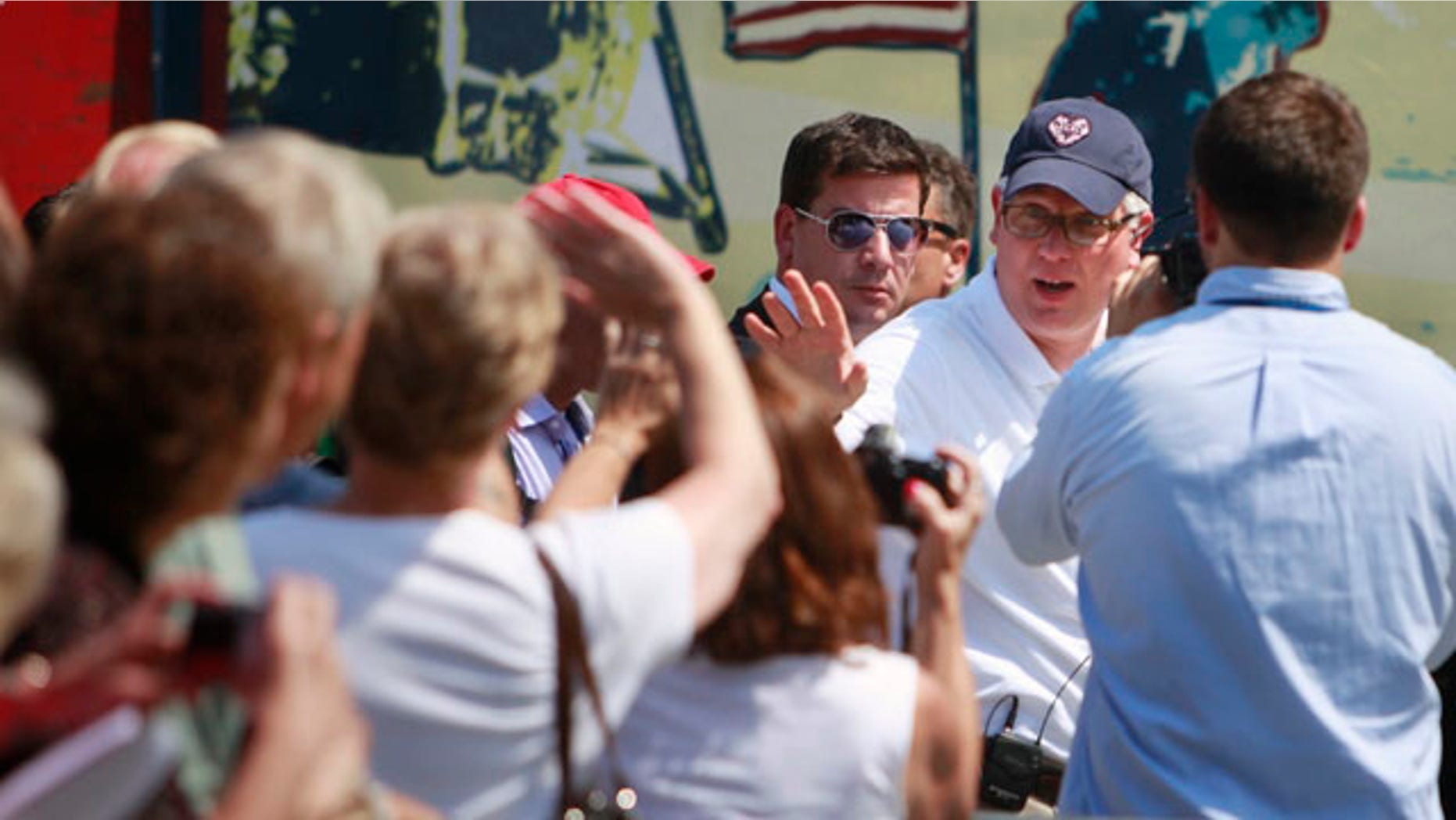 Glenn Beck, right, waves to supporters at the site of the Restoring Honor rally by the Lincoln Memorial in Washington, on Friday, Aug. 27, 2010. The rally will take place on Saturday (AP Photo/Jacquelyn Martin).