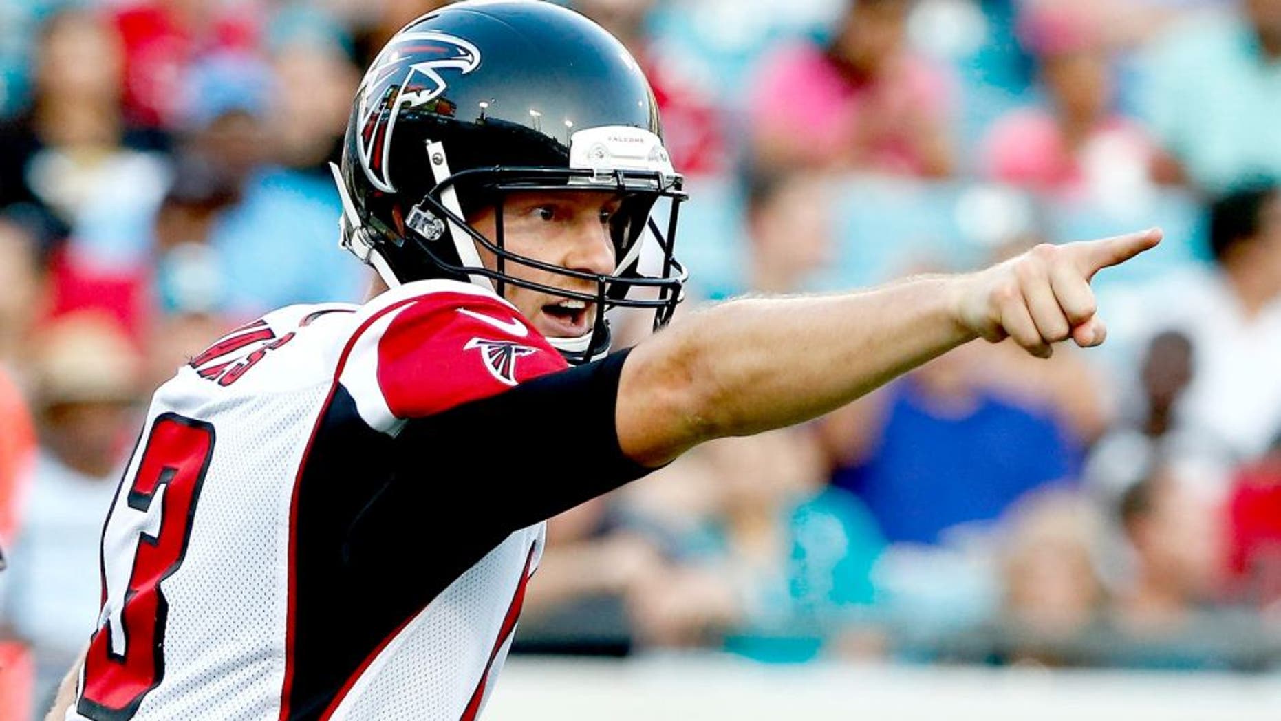 JACKSONVILLE, FL - AUGUST 28: T.J. Yates #13 of the Atlanta Falcons points during the preseason NFL game against the Jacksonville Jaguars at EverBank Field on August 28, 2014 in Jacksonville, Florida. (Photo by Sam Greenwood/Getty Images)