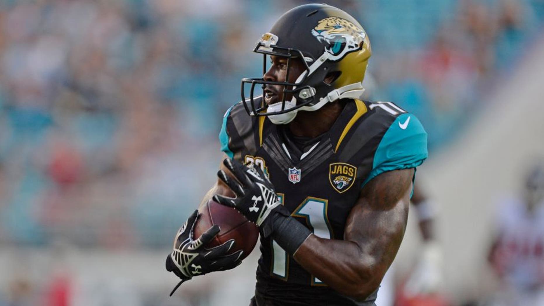 Aug 28, 2014; Jacksonville, FL, USA; Jacksonville Jaguar wide receiver Marqise Lee (11) catches a touchdown pass from quarterback Blake Bortles against the Atlanta Falcons during the 2nd quarter at EverBank Field. Mandatory Credit: Richard Dole-USA TODAY Sports