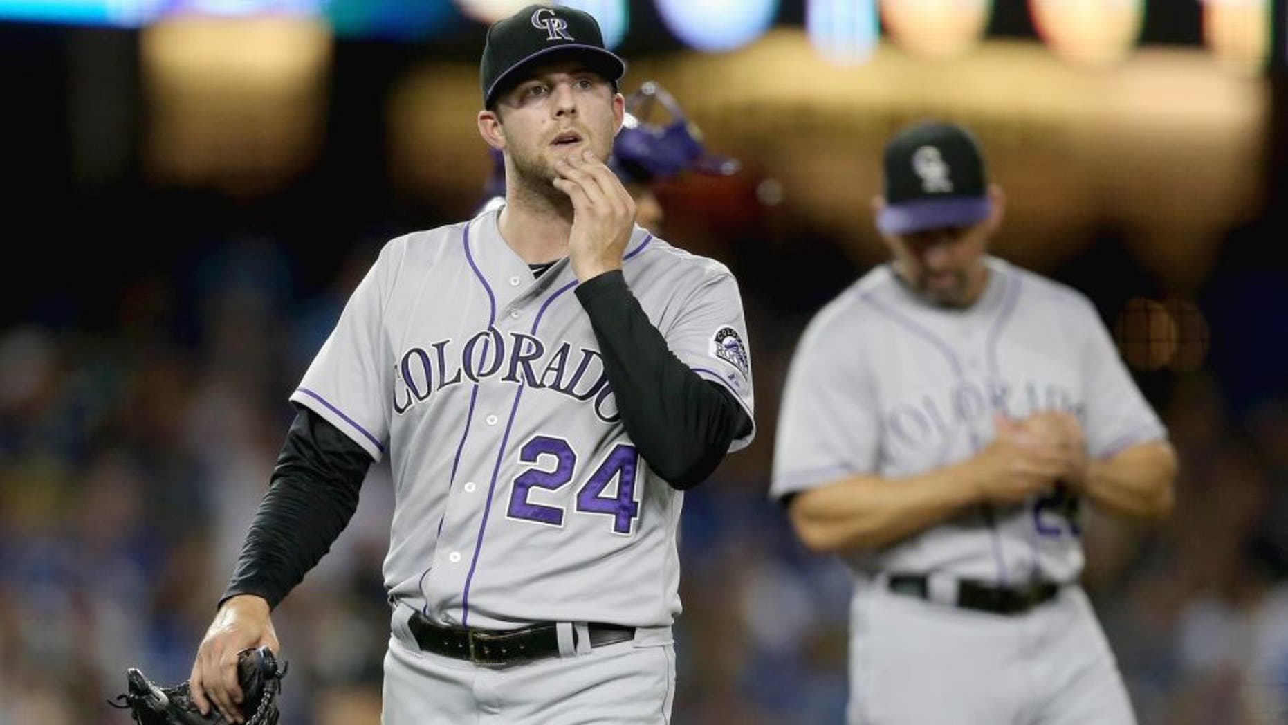 LOS ANGELES, CA - SEPTEMBER 26: Starting pitcher Jordan Lyles #24 of the Colorado Rockies comes out of the game in the sixth inning against the Los Angeles Dodgers at Dodger Stadium on September 26, 2014 in Los Angeles, California. (Photo by Jeff Gross/Getty Images)
