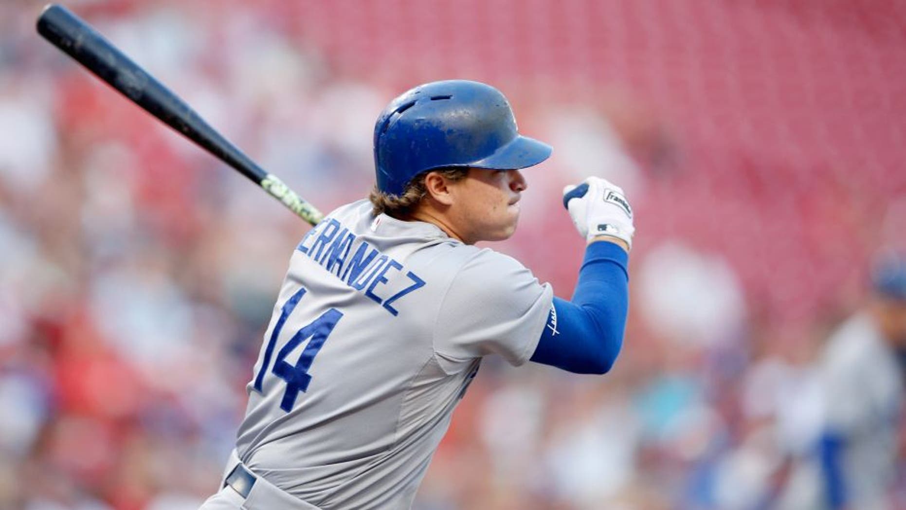 CINCINNATI, OH - AUGUST 26: Enrique Hernandez #14 of the Los Angeles Dodgers singles to right to drive in a run in the second inning against the Cincinnati Reds at Great American Ball Park on August 26, 2015 in Cincinnati, Ohio. (Photo by Joe Robbins/Getty Images)