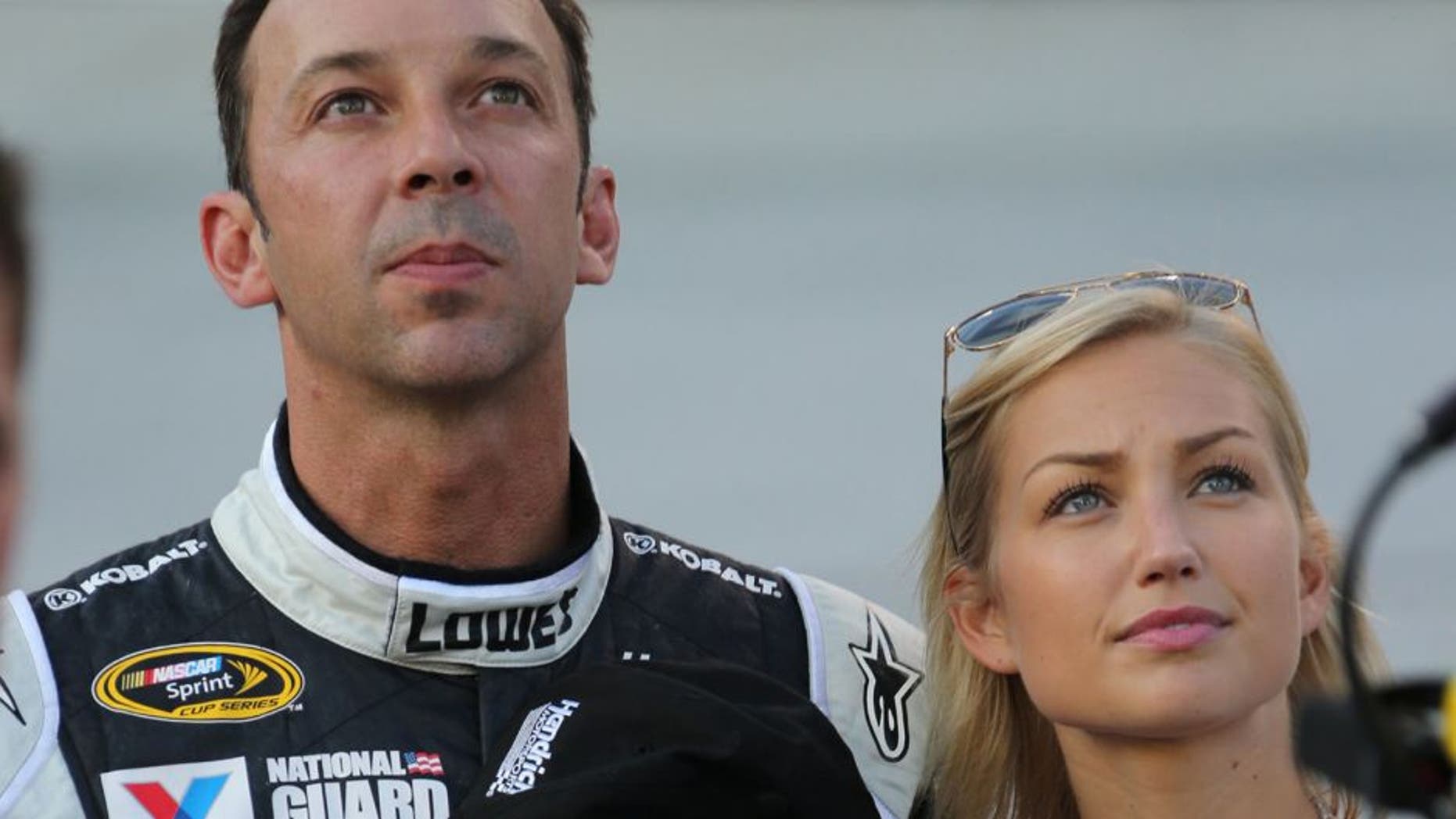 USA -Aug 23: NASCAR Sprint Cup Series crew chief Chad Knaus and his girlfriend Brooke Werner stand on pit road during the National Anthem prior to the start of the NASCAR Sprint Cup Series Irwin Tools Night Race at the Bristol Motor Speedway in Bristol, TN. Picture taken on Aug 23, 2014 in the United States. (Photo by Jim Fluharty/NASCAR Illustrated/Sporting News via Getty Images)