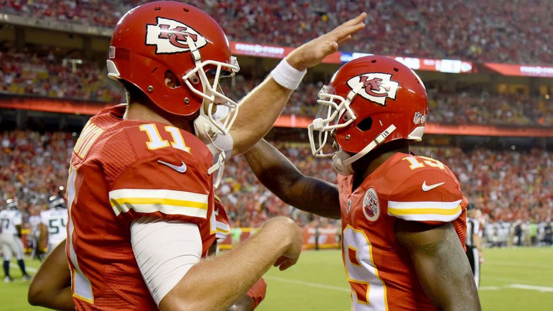 Aug 21, 2015; Kansas City, MO, USA; Kansas City Chiefs wide receiver Jeremy Maclin (19) celebrates with quarterback Alex Smith (11) after catching a touchdown pass against the Seattle Seahawks in the first half at Arrowhead Stadium. Mandatory Credit: John Rieger-USA TODAY Sports