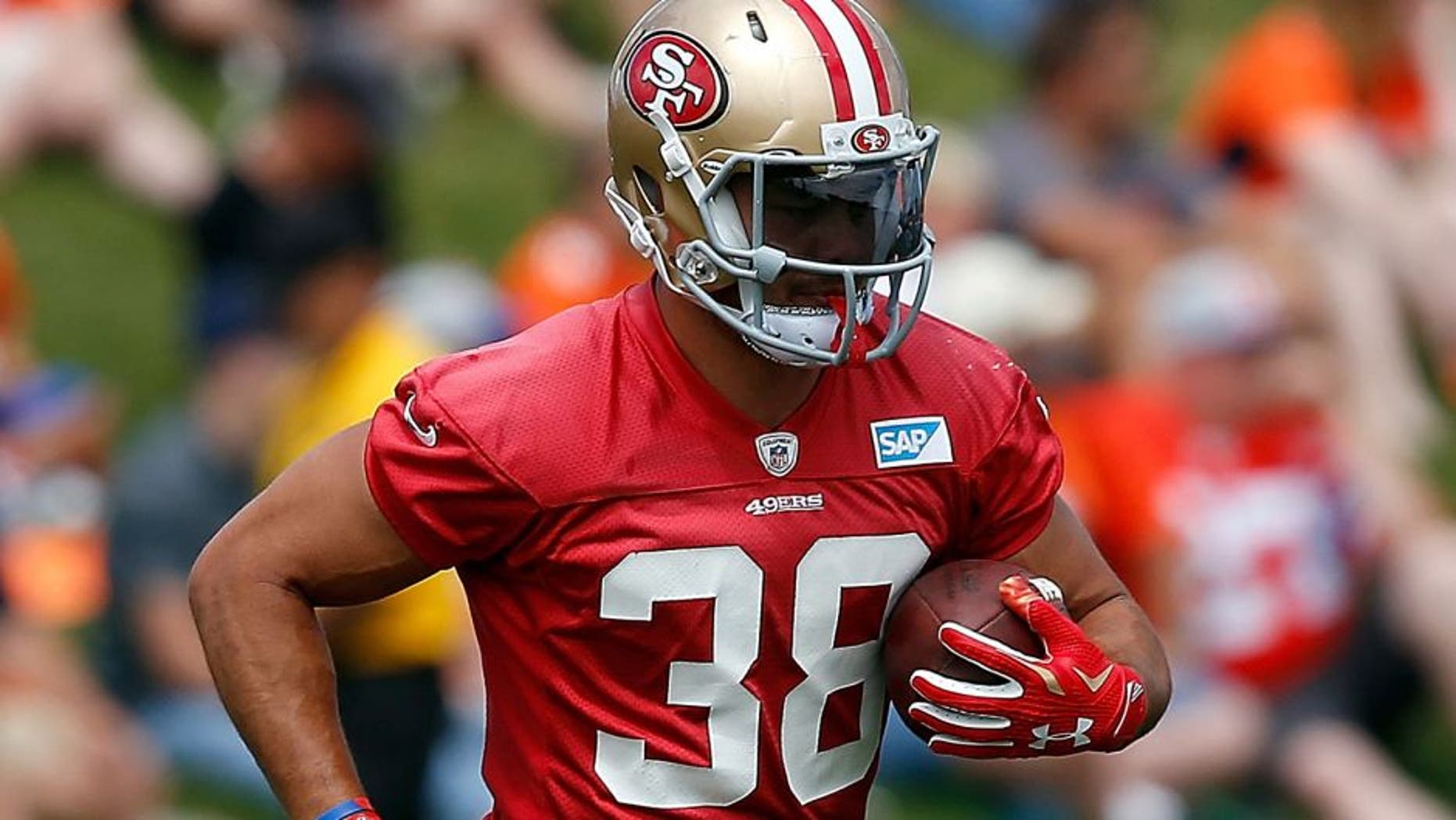 ENGLEWOOD, CO - AUGUST 27: Jarryd Hayne #38 of the San Francisco 49ers carries the ball as he works out during a joint training session with the San Francisco 49ers and the Denver Broncos at the Denver Broncos Training Facility on August 27, 2015 in Englewood, Colorado. (Photo by Doug Pensinger/Getty Images)