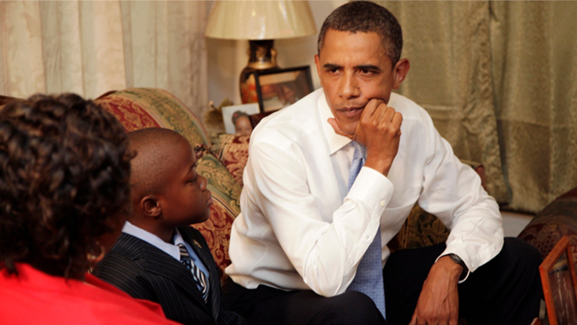Aug. 29: President Obama talks with resident Maude Smith and her grandson David Robichaux Jr., 9, in her Columbia Parc Development home in New Orleans on the fifth anniversary of Hurricane Katrina.