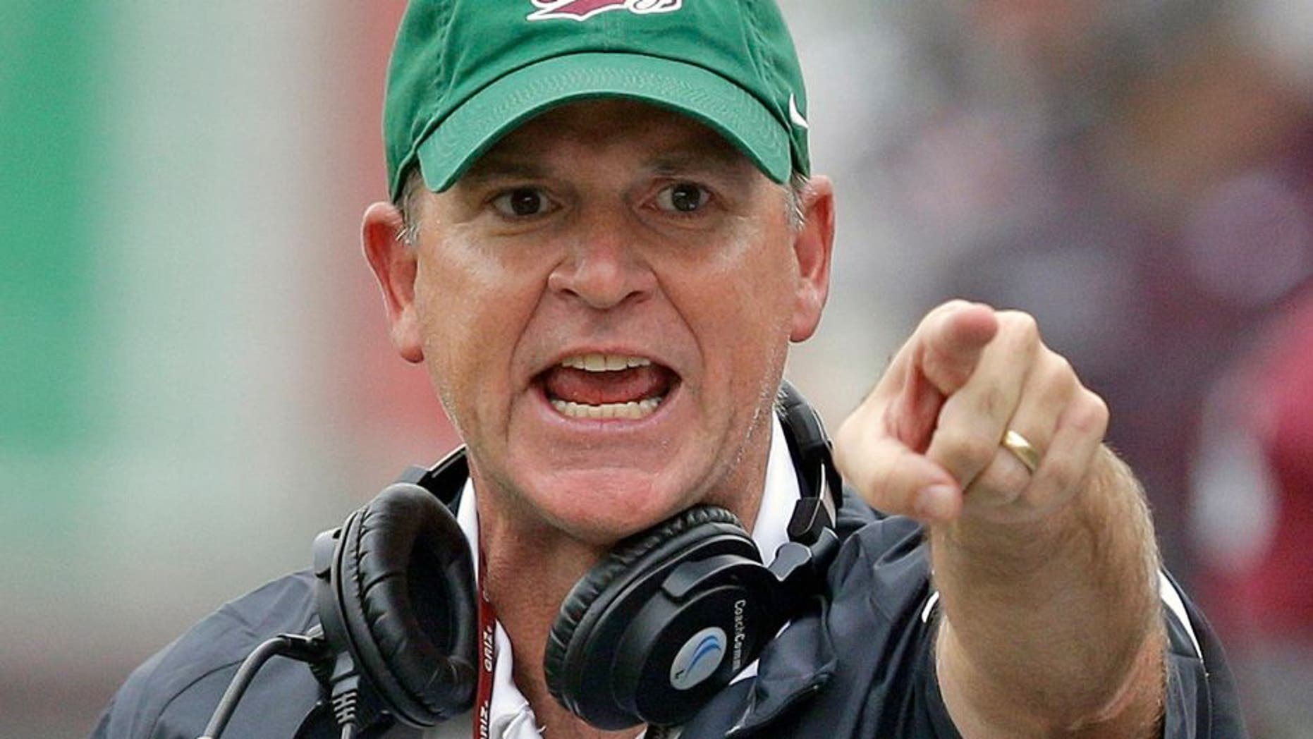 Montana's head coach Bob Stitt shouts during the first half of their NCAA college football game against North Dakota State Saturday, Aug. 29, 2015, in Missoula, in Mont. (AP Photo/Rick Bowmer)