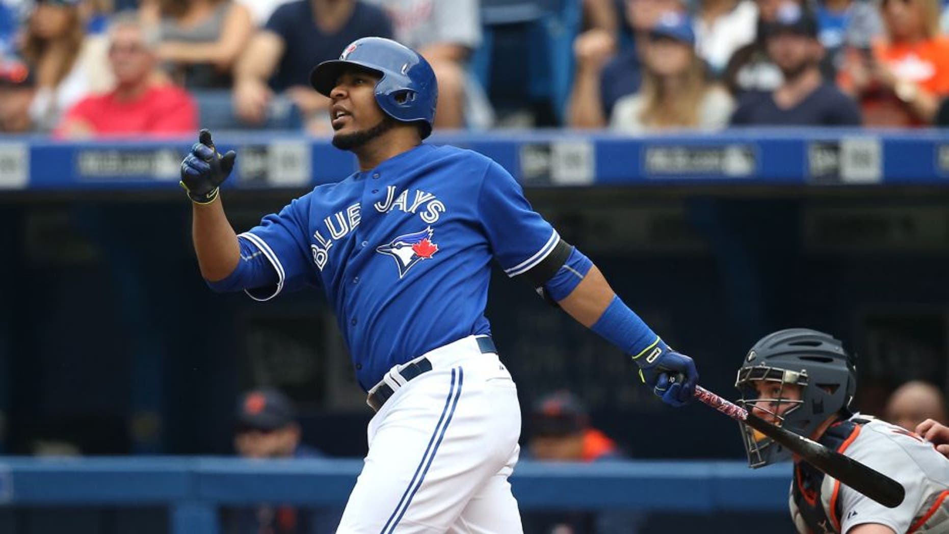 TORONTO, CANADA - AUGUST 29: Edwin Encarnacion #10 of the Toronto Blue Jays hits a three-run home run in the first inning during MLB game action against the Detroit Tigers on August 29, 2015 at Rogers Centre in Toronto, Ontario, Canada. (Photo by Tom Szczerbowski/Getty Images)