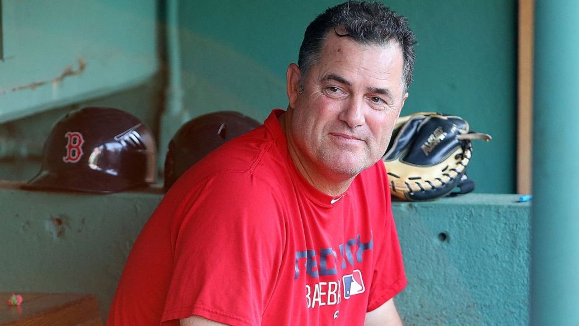 BOSTON, MA - AUGUST 19: John Farrell #53 of the Boston Red Sox makes a visit to the dugout before a game against the Cleveland Indians at Fenway Park on August 19, 2015 in Boston, Massachusetts. Last week, Farrell relinquished his duties as manager to undergo treatment for lymphoma. (Photo by Jim Rogash/Getty Images)