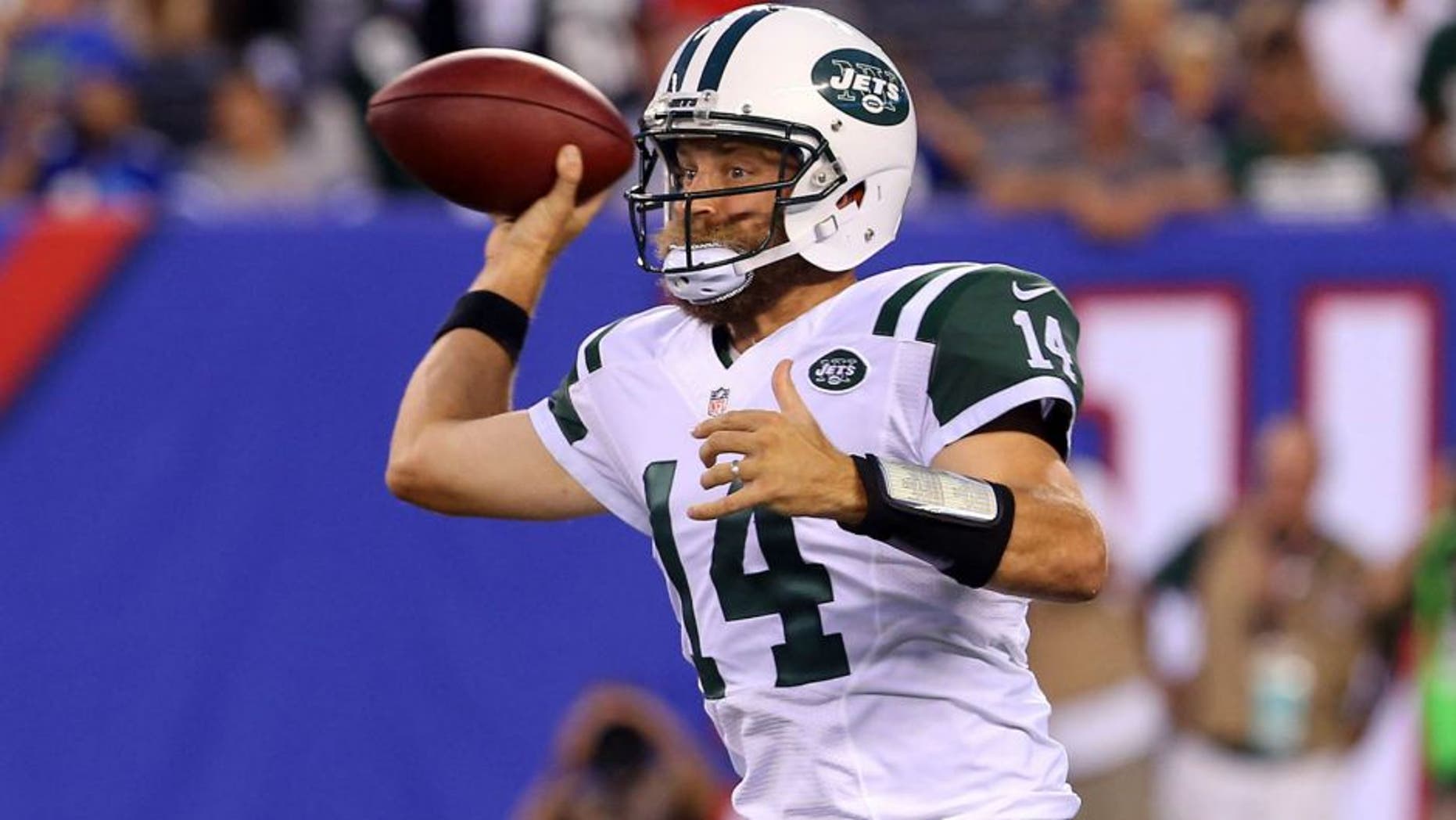 Aug 29, 2015; East Rutherford, NJ, USA; New York Jets quarterback Ryan Fitzpatrick (14) throws a pass during the first half of their game against the New York Giants at MetLife Stadium. Mandatory Credit: Ed Mulholland-USA TODAY Sports