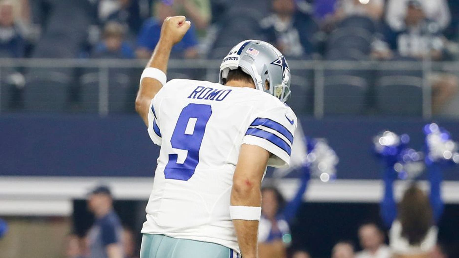 Dallas Cowboys quarterback Tony Romo (9) celebrates his touchdown pass against the Minnesota Vikings during the first half of a preseason NFL football game Saturday, Aug. 29, 2015, in Arlington, Texas. (AP Photo/Tony Gutierrez)
