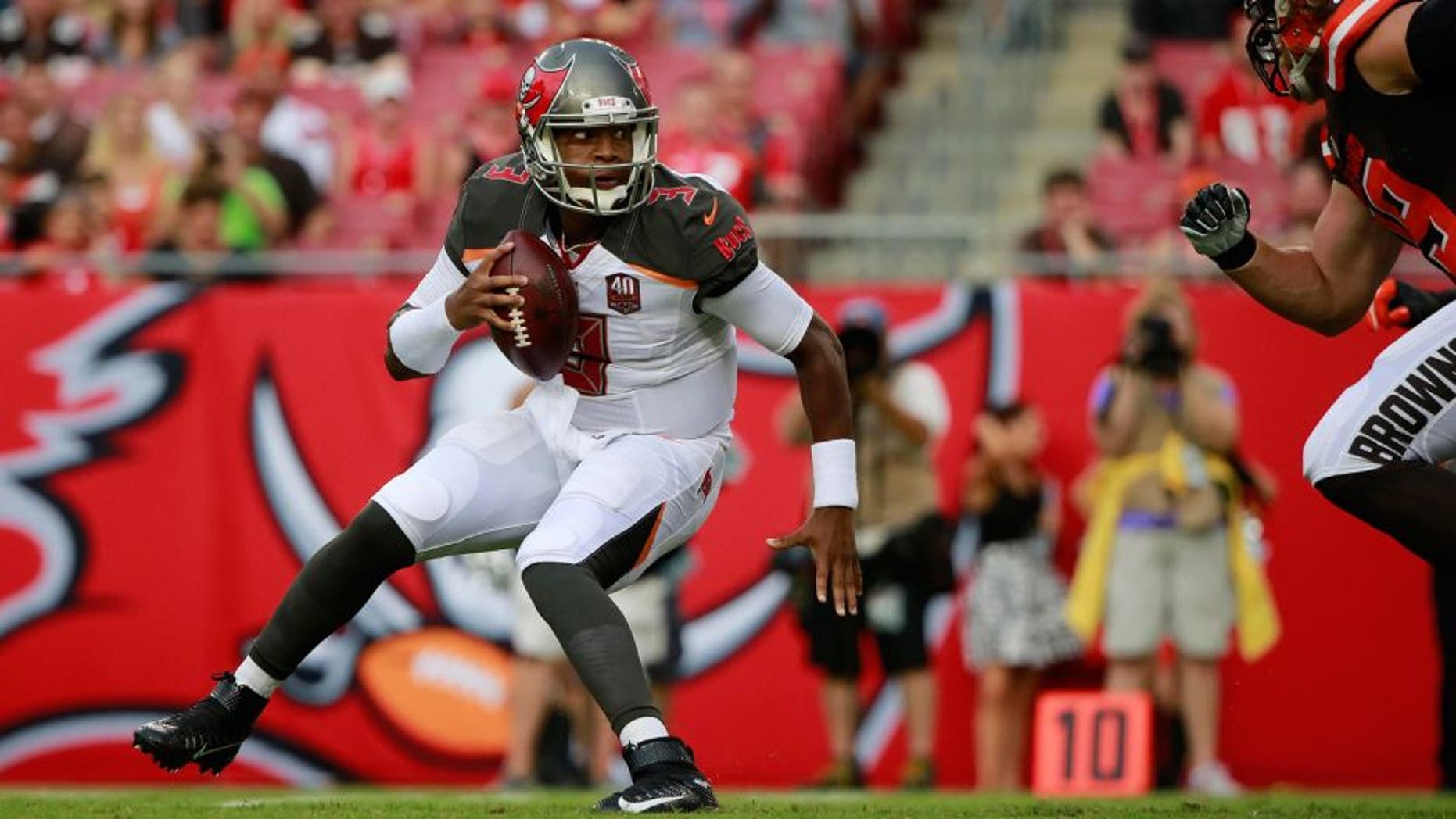 Aug 29, 2015; Tampa, FL, USA; Tampa Bay Buccaneers quarterback Jameis Winston (3) gets pressured against the Cleveland Browns during the first quarter at Raymond James Stadium. Mandatory Credit: Kim Klement-USA TODAY Sports
