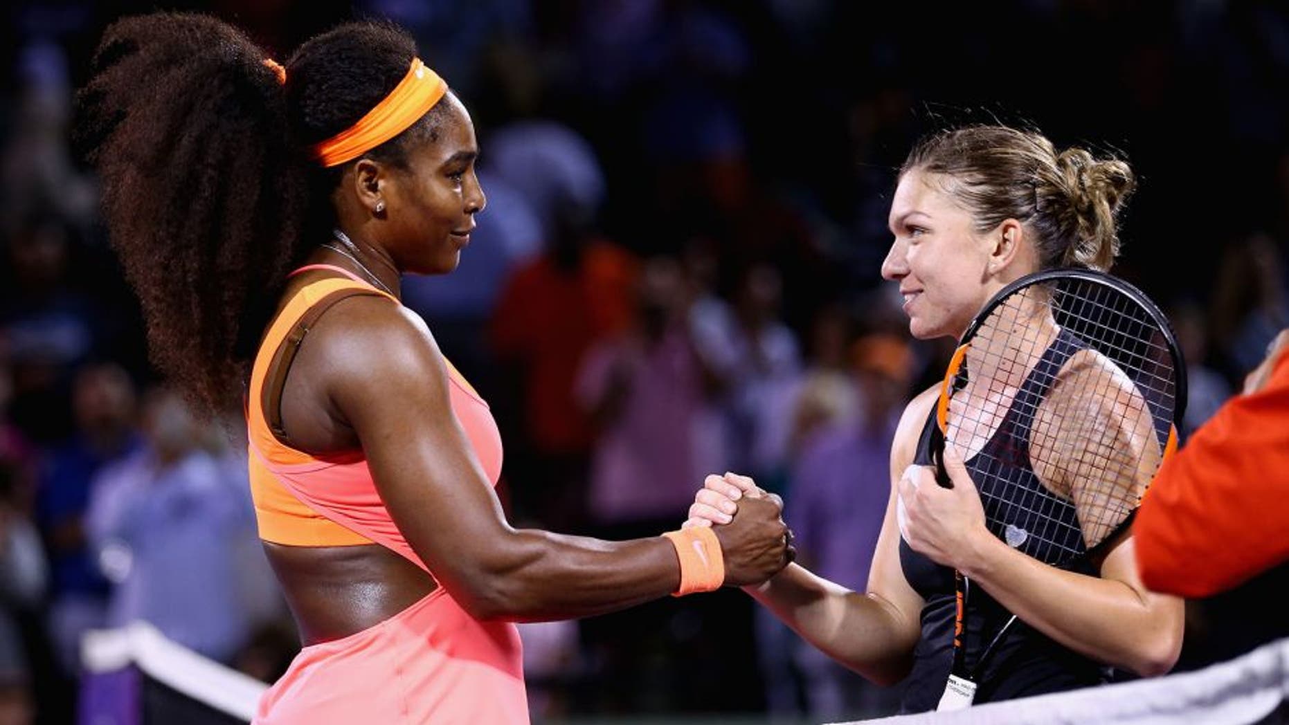 KEY BISCAYNE, FL - APRIL 02: Serena Williams of the United States shakes hands at the net after her three set victory against Simona Halep of Romania in their semi final match during the Miami Open Presented by Itau at Crandon Park Tennis Center on April 2, 2015 in Key Biscayne, Florida. (Photo by Clive Brunskill/Getty Images)