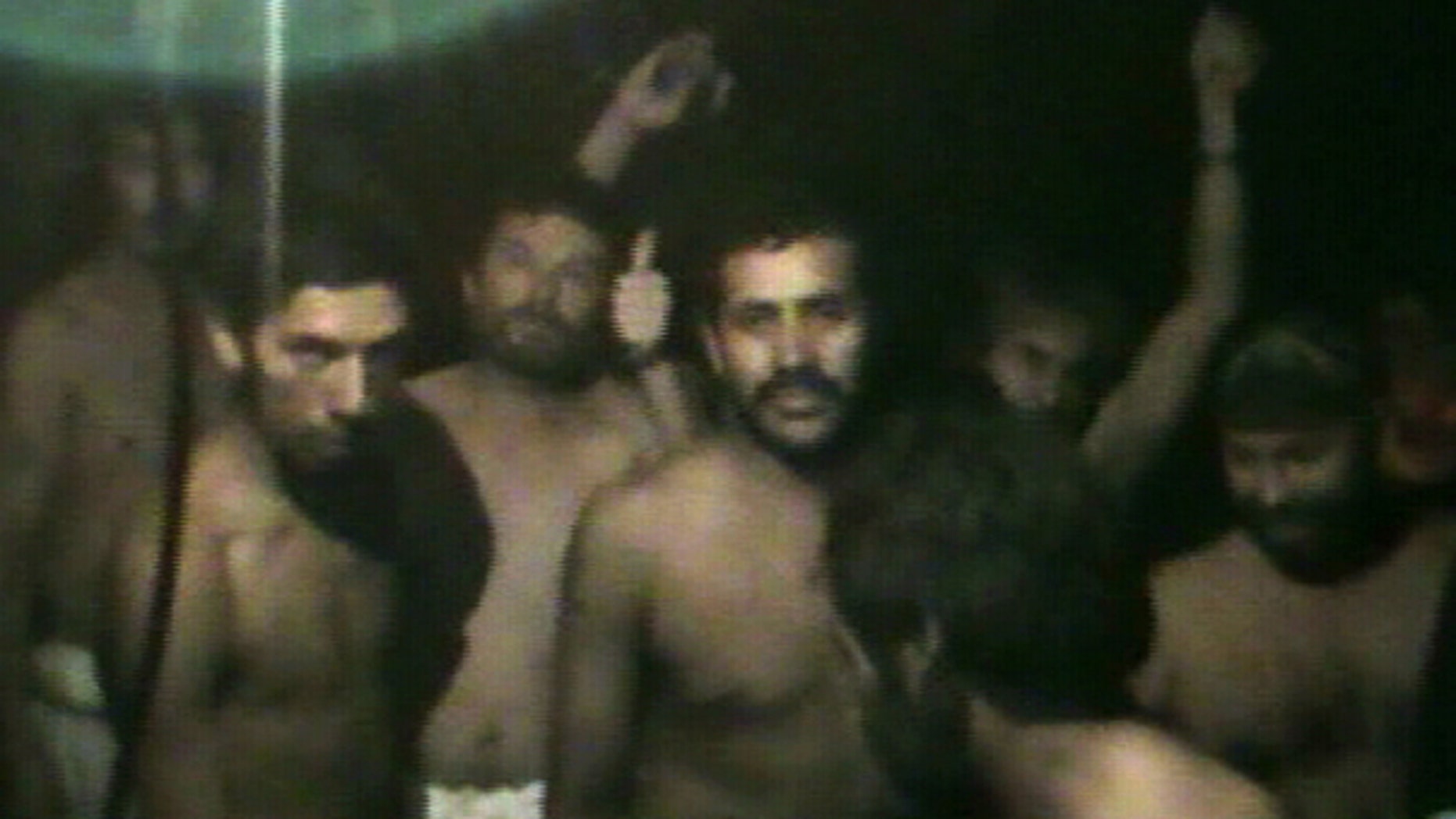 Aug. 29: This TV grab taken from a video released by Chile's government shows some of 33 trapped miners the San Jose mine in Copiapo.