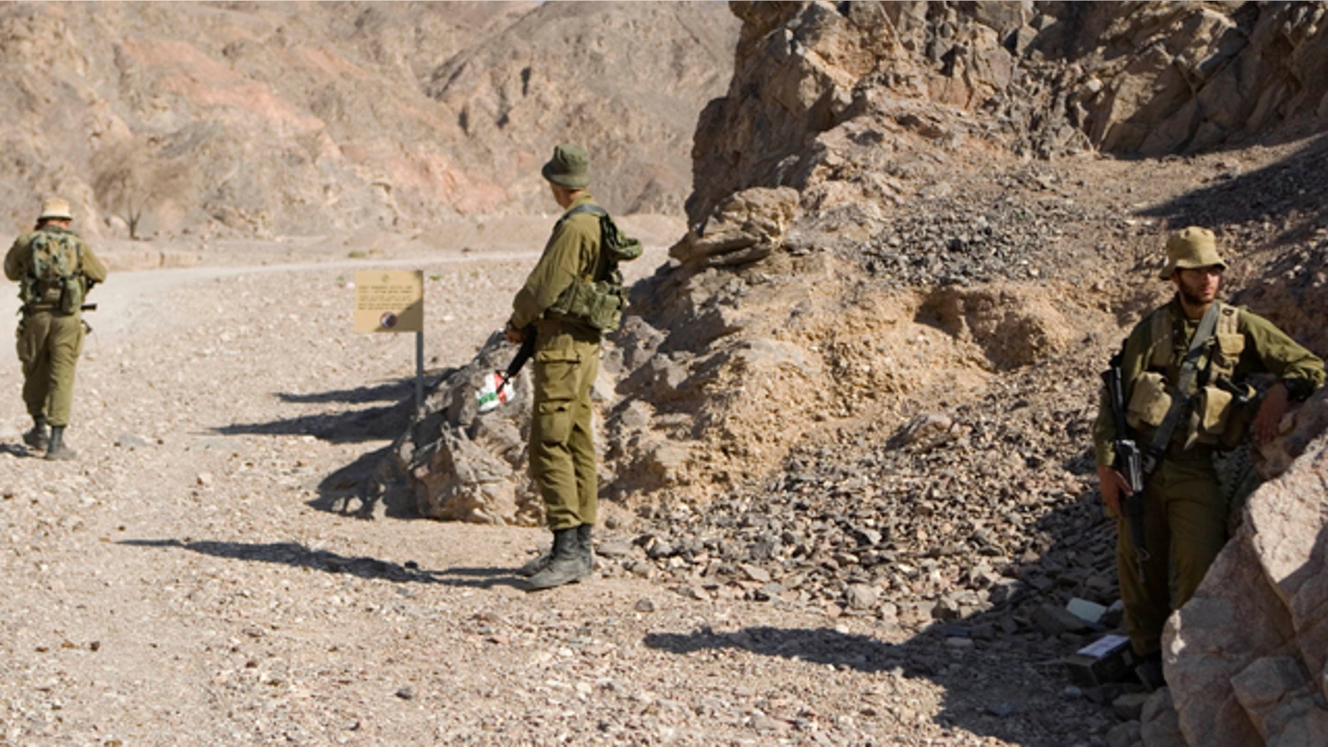 Aug. 19: Israeli soldiers secure the area near roads leading to the sites of several attacks in the Arava desert, near the southern Israeli resort town of Eilat.