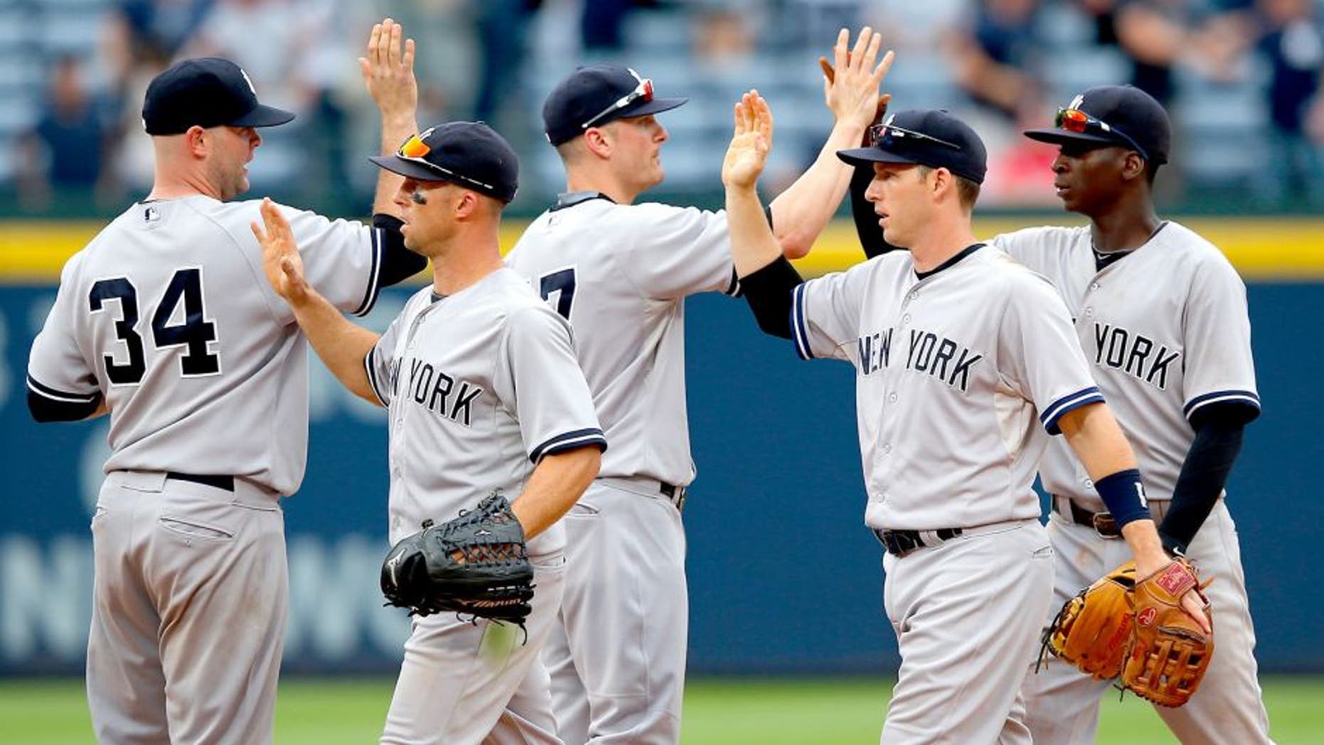 ATLANTA, GA - AUGUST 30: The New York Yankees celebrate their 20-6 win over the Atlanta Braves at Turner Field on August 30, 2015 in Atlanta, Georgia. (Photo by Kevin C. Cox/Getty Images)
