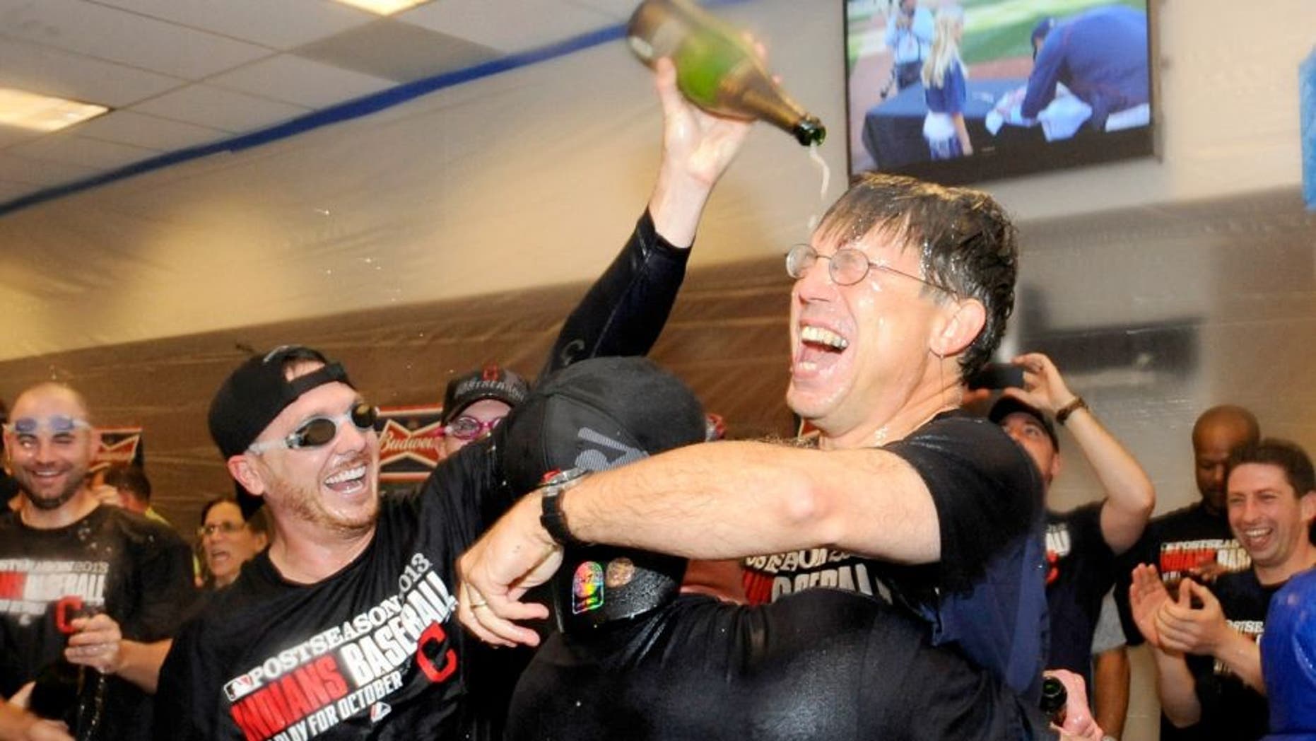 MINNEAPOLIS, MN - SEPTEMBER 29: Owner and CEO Paul Dolan of the Cleveland Indians celebrates with his team in the clubhouse after a win of the game against the Minnesota Twins on September 29, 2013 at Target Field in Minneapolis, Minnesota. The Indians defeated the Twins 5-1 and clinched a American League Wild Card berth. (Photo by Hannah Foslien/Getty Images)