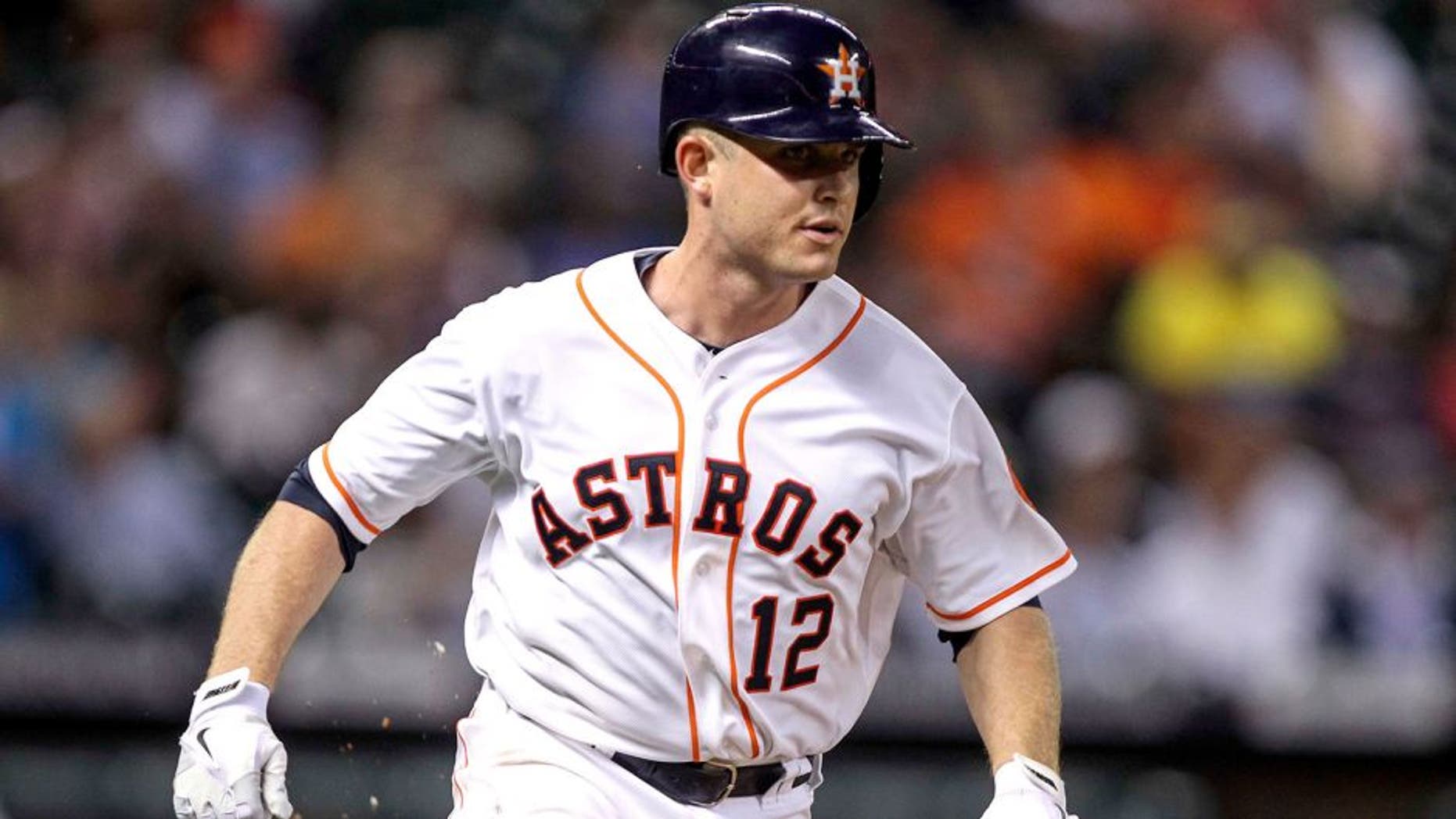 Sep 16, 2014; Houston, TX, USA; Houston Astros catcher Max Stassi (12) runs to first base with a single during the fourth inning against the Cleveland Indians at Minute Maid Park. Mandatory Credit: Troy Taormina-USA TODAY Sports