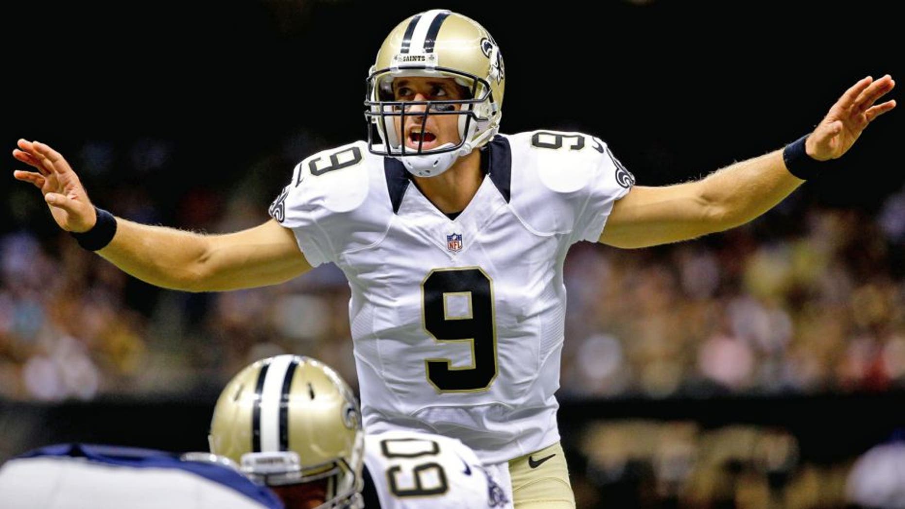 Aug 22, 2015; New Orleans, LA, USA; New Orleans Saints quarterback Drew Brees (9) audibles against the New England Patriots during the first quarter of a preseason game at the Mercedes-Benz Superdome. Mandatory Credit: Derick E. Hingle-USA TODAY Sports