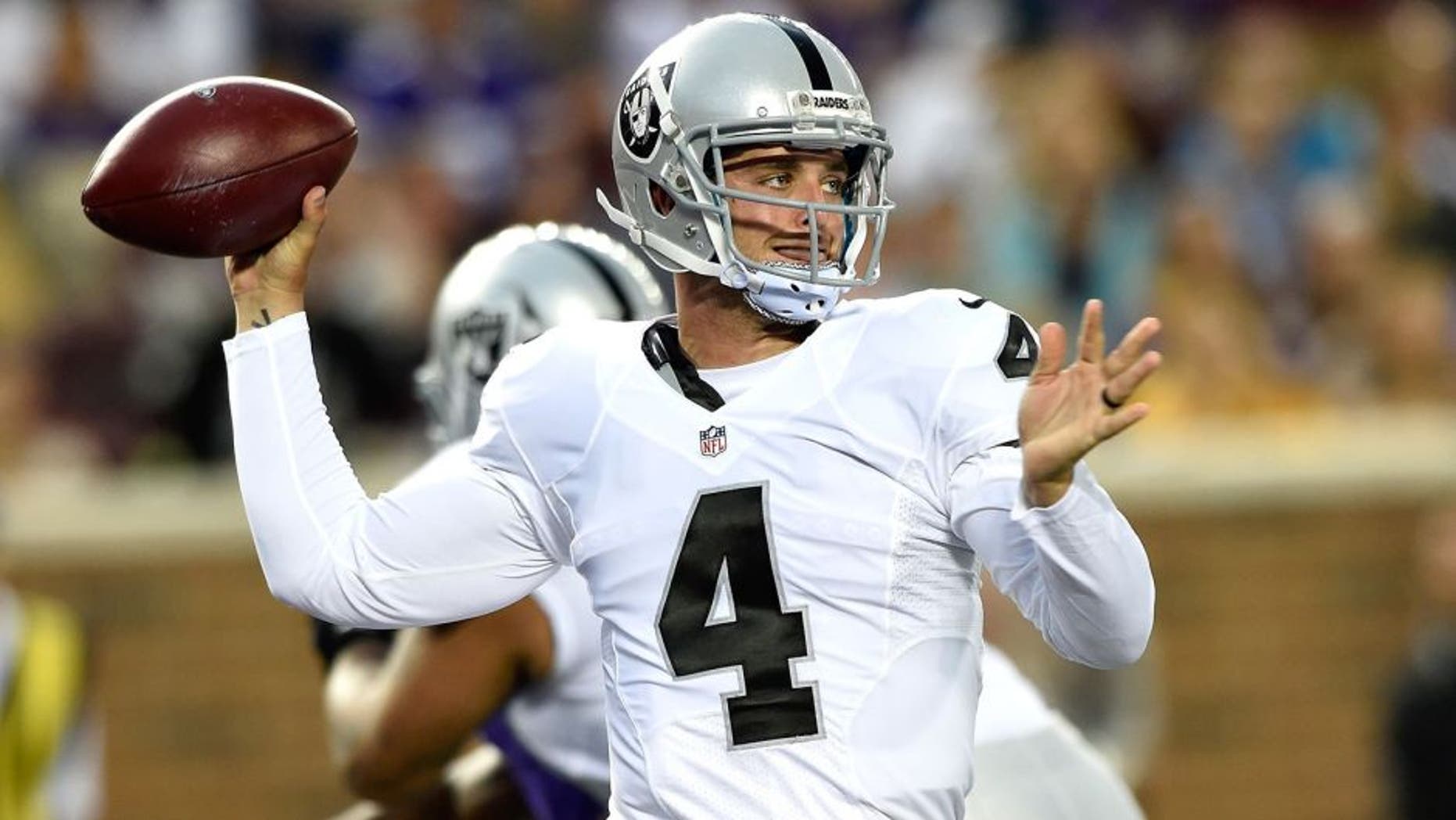 MINNEAPOLIS, MN - AUGUST 22: Derek Carr #4 of the Oakland Raiders passes the ball during the first quarter of the preseason game against the Minnesota Vikings on August 22, 2015 at TCF Bank Stadium in Minneapolis, Minnesota. (Photo by Hannah Foslien/Getty Images)