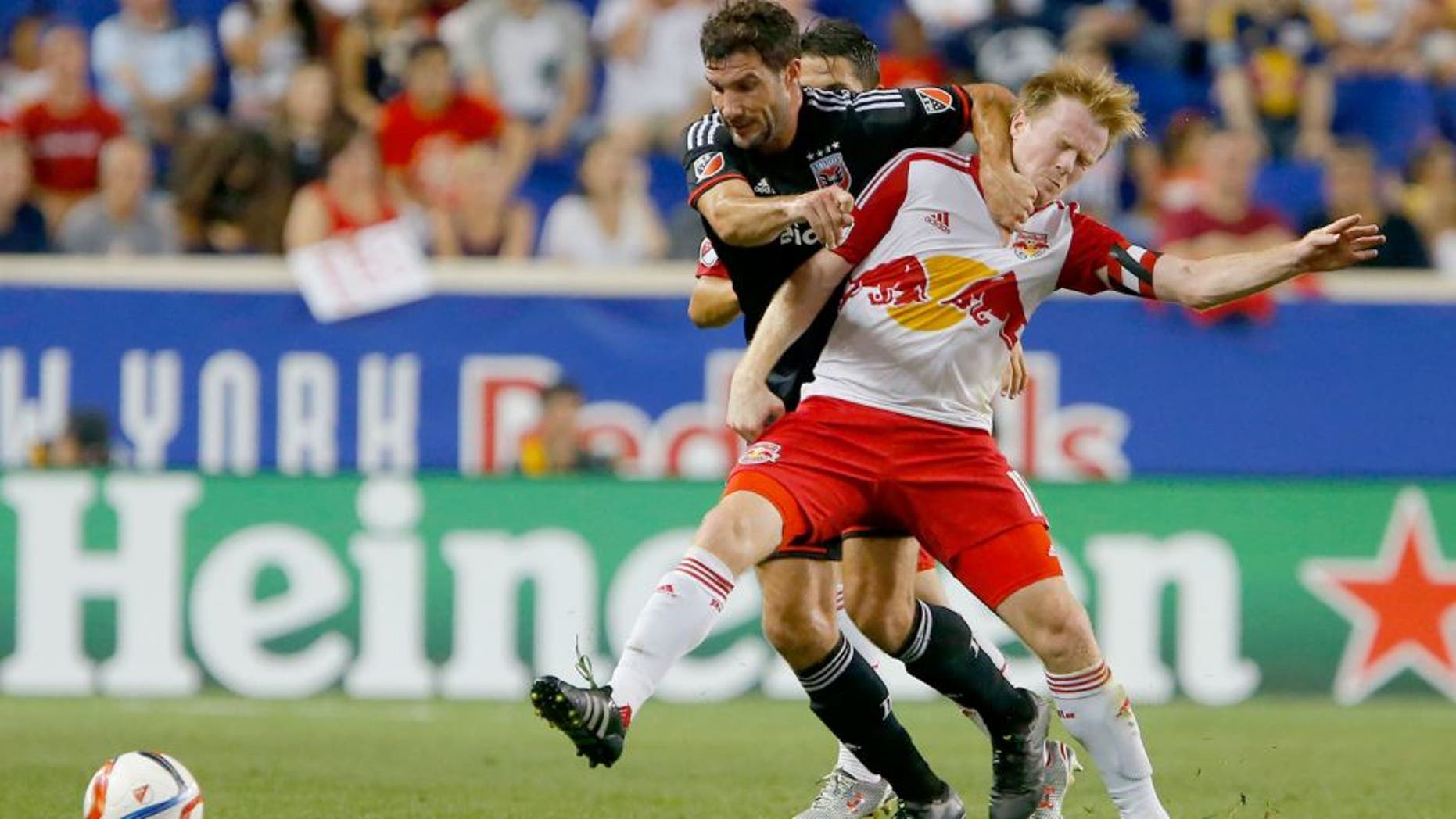 Aug 30, 2015; Harrison, NJ, USA; D.C. United midfielder/forward Chris Pontius (13) and New York Red Bulls midfielder Dax McCarty (11) battle for the ball during first half at Red Bull Arena. Mandatory Credit: Noah K. Murray-USA TODAY Sports