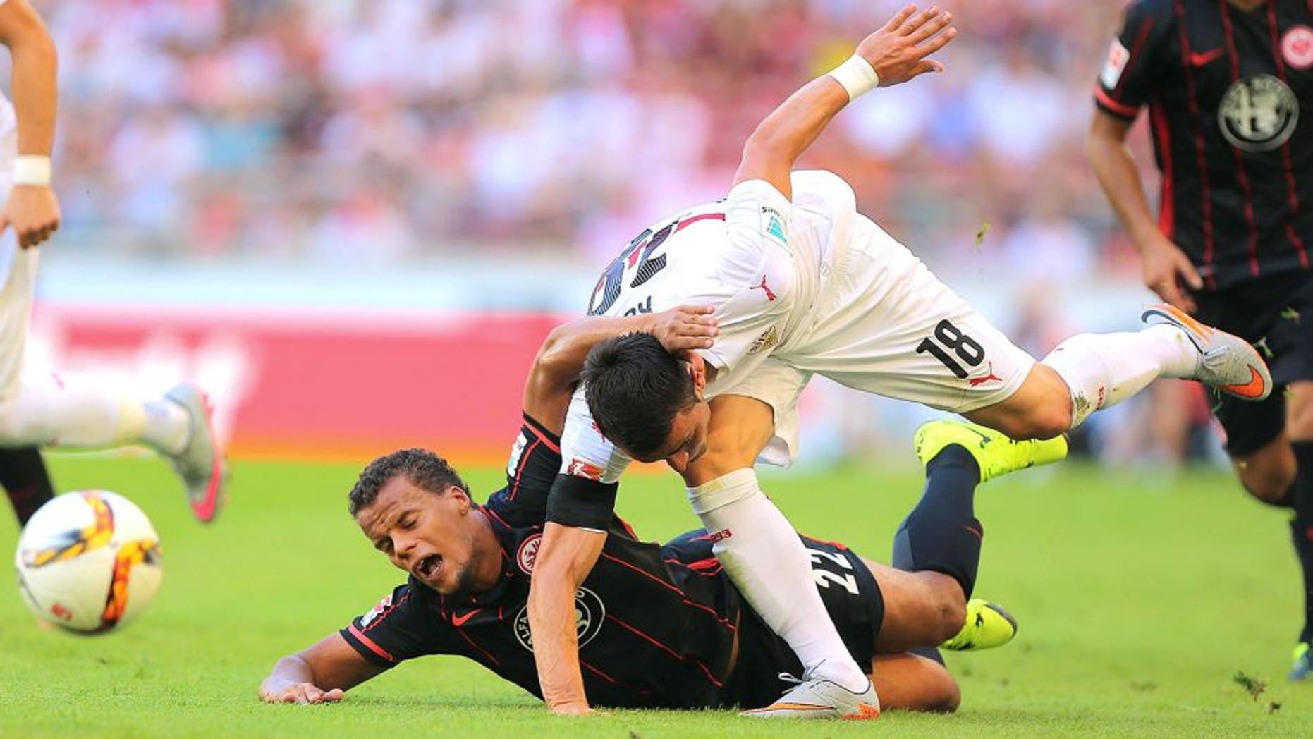 STUTTGART, GERMANY - AUGUST 29: Filip Kostic (R) of Stuttgart fights for the ball with Timothy Chandler (L) of Frankfurt during the Bundesliga match between VfB Stuttgart and Eintracht Frankfurt at Mercedes-Benz Arena on August 29, 2015 in Stuttgart, Germany. (Photo by Thomas Niedermueller/Bongarts/Getty Images)