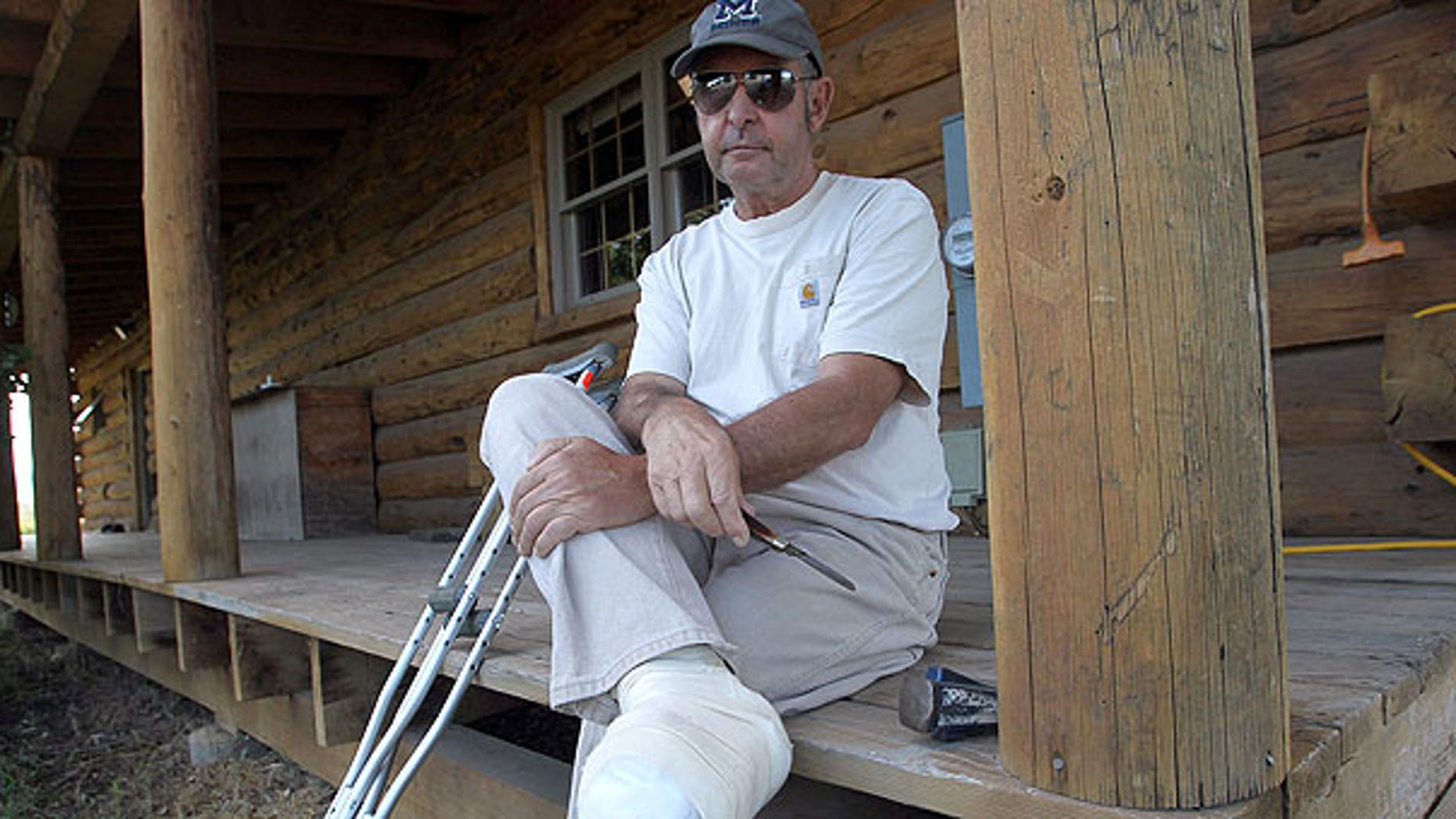 Aug. 30: John Hutt holds his Old Timer pocketknife while sitting on the front porch of his home in Montrose, Colo.