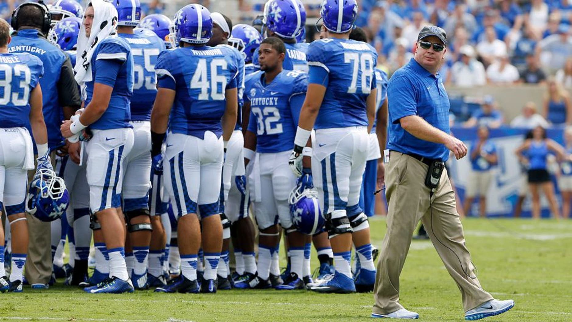 Aug 30, 2014; Lexington, KY, USA; Kentucky Wildcats head coach Mark Stoops during a time out in the game against the UT Martin Skyhawks in the second half at Commonwealth Stadium. Kentucky defeated UT Martin 59-14. Mandatory Credit: Mark Zerof-USA TODAY Sports