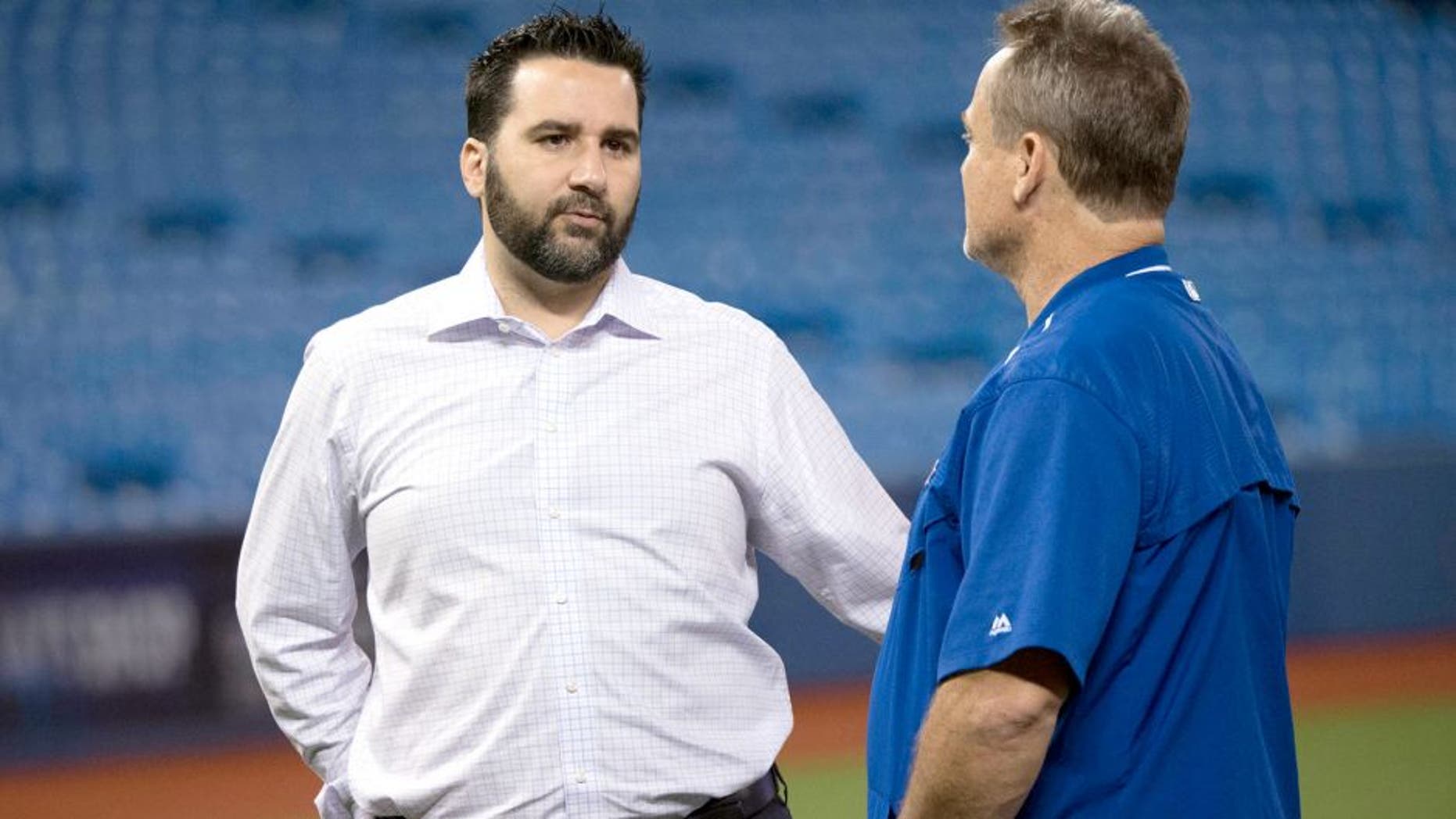 Aug 1, 2015; Toronto, Ontario, CAN; Toronto Blue Jays general manager Alex Anthopoulos talks with Toronto Blue Jays manager John Gibbons (right) during batting practice before a game against the Kansas City Royals at Rogers Centre. The Kansas City Royals won 7-6. Mandatory Credit: Nick Turchiaro-USA TODAY Sports