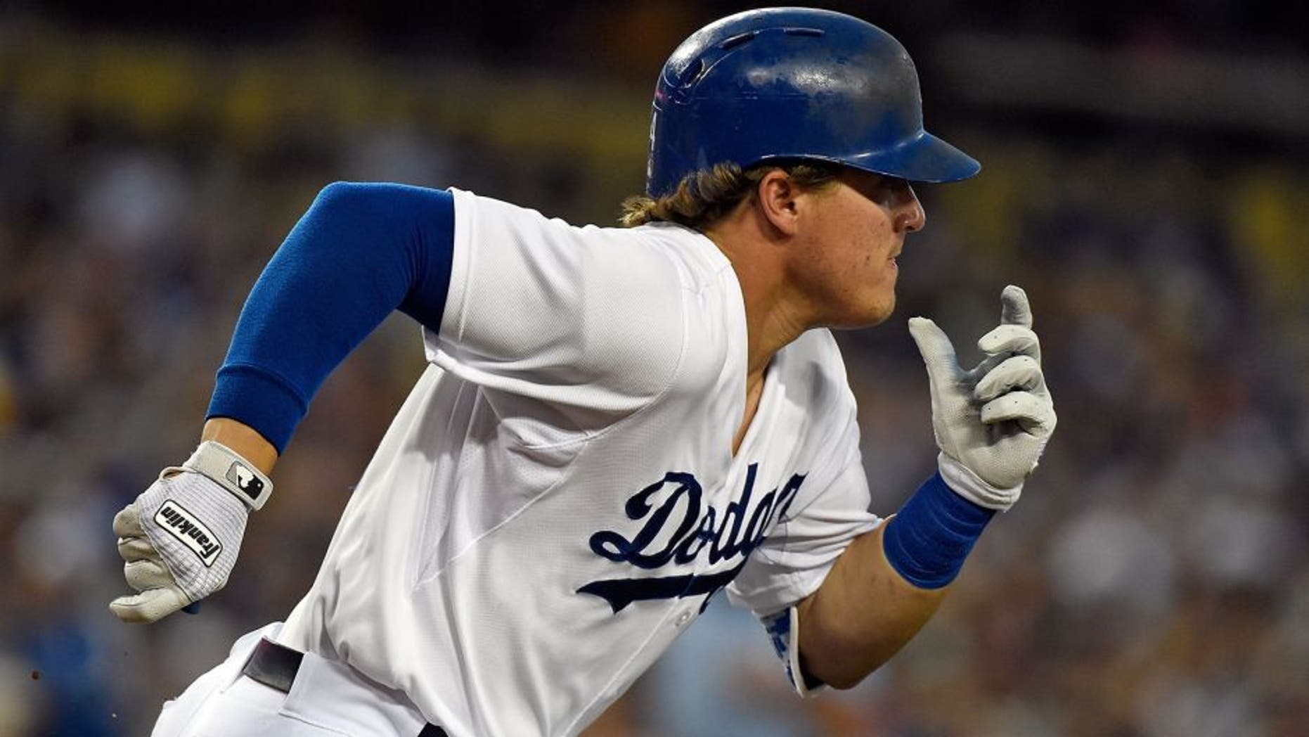 LOS ANGELES, CA - AUGUST 11: Enrique Hernandez #14 of the Los Angeles Dodgers runs to first base during the game against the Washington Nationals at Dodger Stadium on August 11, 2015 in Los Angeles, California. (Photo by Lisa Blumenfeld/Getty Images)