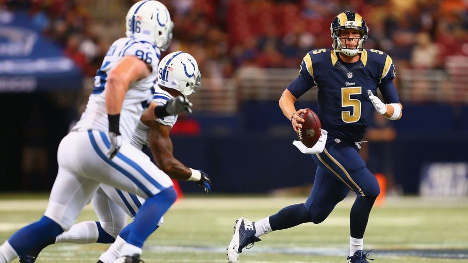 ST. LOUIS, MO - AUGUST 29: Nick Foles #5 of the St. Louis Rams looks to pass the ball against the Indianapolis Colts in the second quarter during a preseason game at the Edward Jones Dome on August 29, 2014 in St. Louis, Missouri. (Photo by Dilip Vishwanat/Getty Images)
