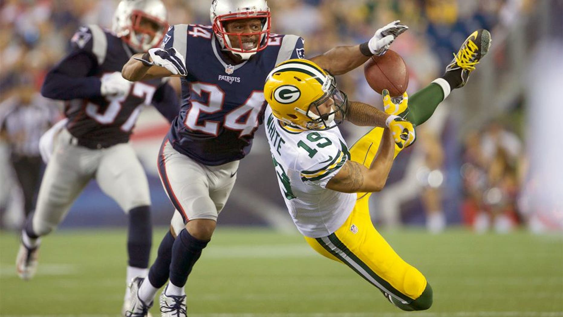 Aug 13, 2015; Foxborough, MA, USA; New England Patriots defensive back Bradley Fletcher (24) defends against Green Bay Packers wide receiver Myles White (19) during the first half in a preseason NFL football game at Gillette Stadium. Mandatory Credit: David Butler II-USA TODAY Sports