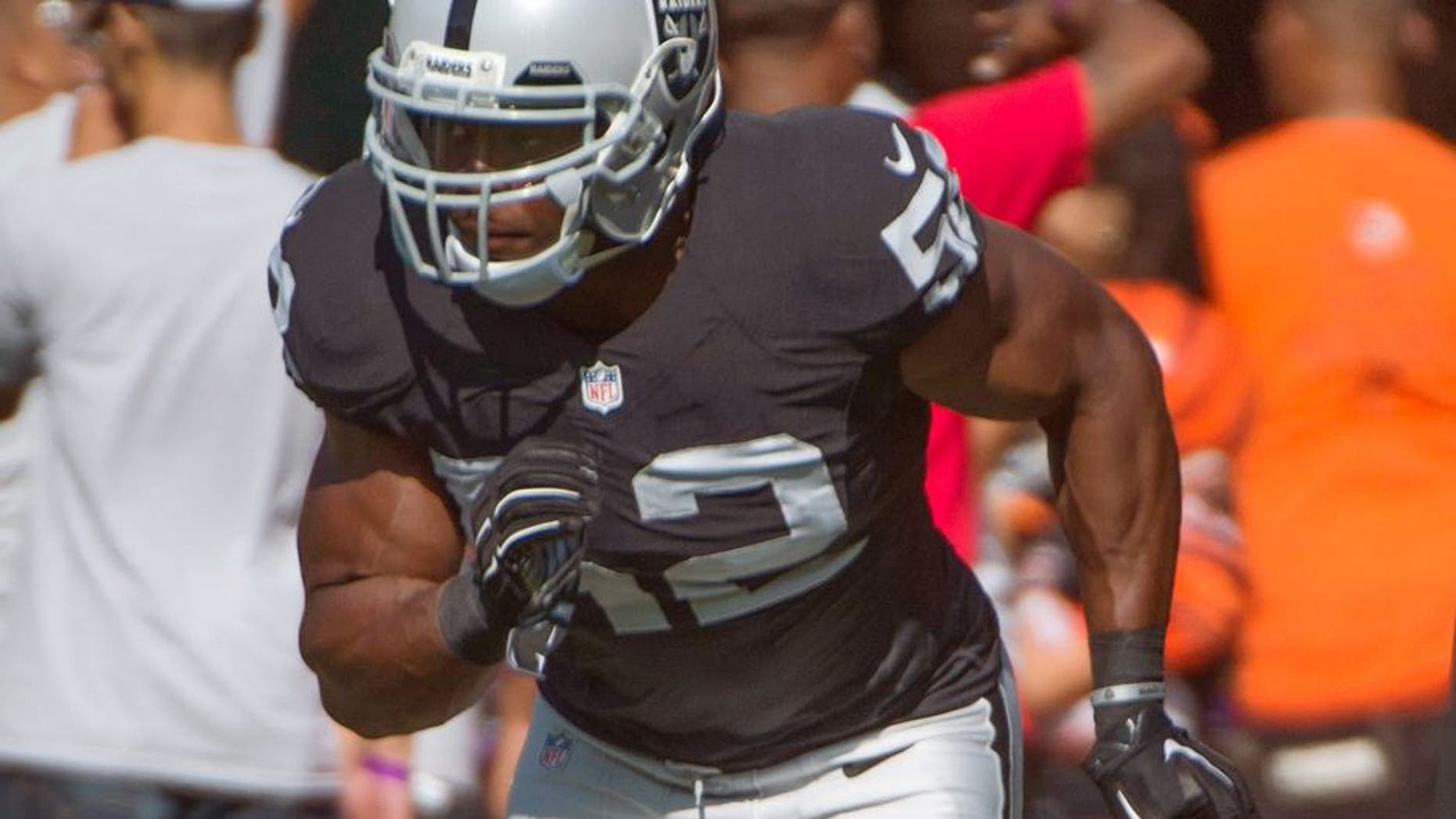 August 30, 2015; Oakland, CA, USA; Oakland Raiders outside linebacker Khalil Mack (52) warms up before a preseason NFL football game against the Arizona Cardinals at O.co Coliseum. Mandatory Credit: Kyle Terada-USA TODAY Sports