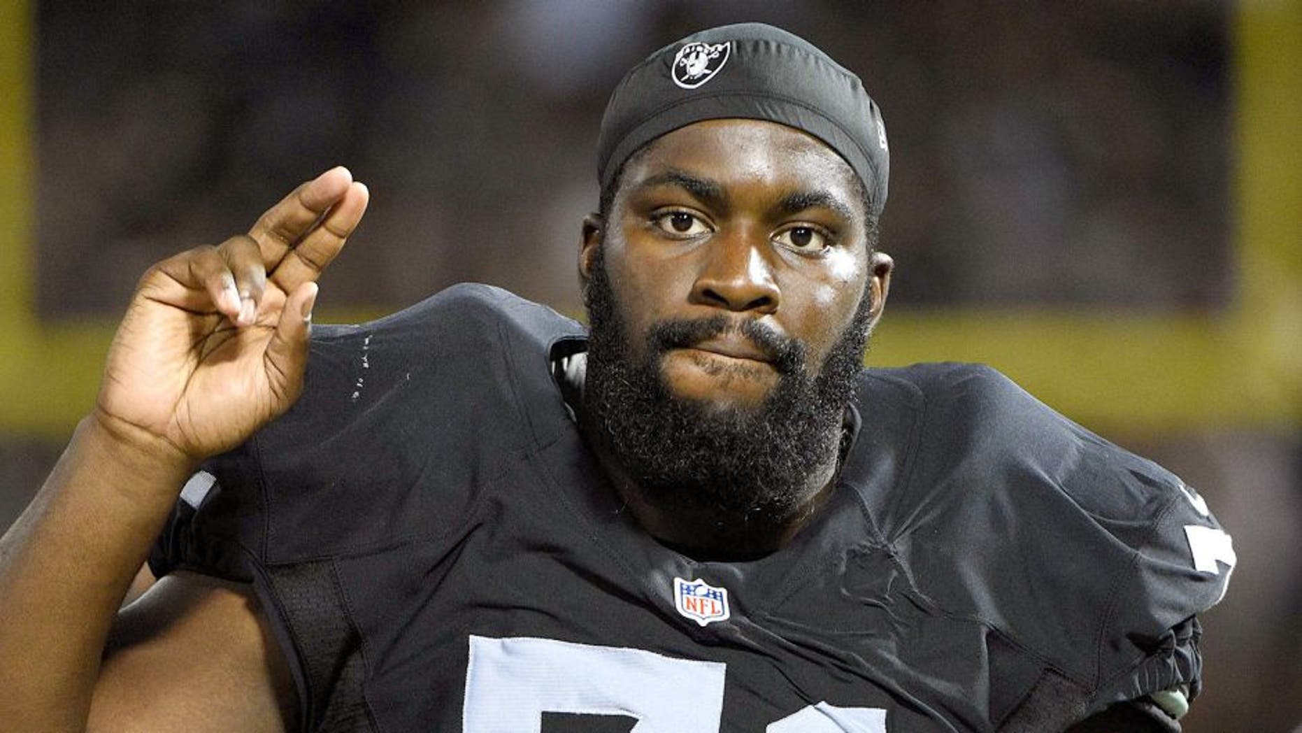 August 14, 2015; Oakland, CA, USA; Oakland Raiders tackle Menelik Watson (71) on the sideline during the fourth quarter in a preseason NFL football game against the St. Louis Rams at O.co Coliseum. The Raiders defeated the Rams 18-3. Mandatory Credit: Kyle Terada-USA TODAY Sports