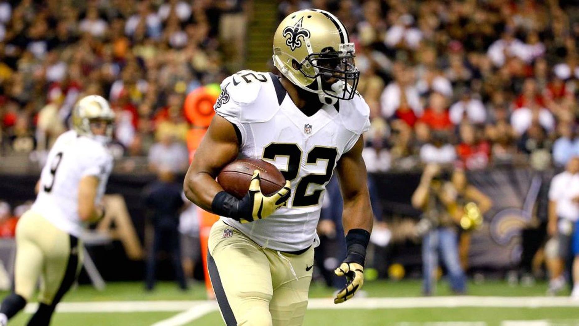Aug 30, 2015; New Orleans, LA, USA; New Orleans Saints running back Mark Ingram (22) runs against the Houston Texans during the first quarter of a preseason game at the Mercedes-Benz Superdome. Mandatory Credit: Derick E. Hingle-USA TODAY Sports