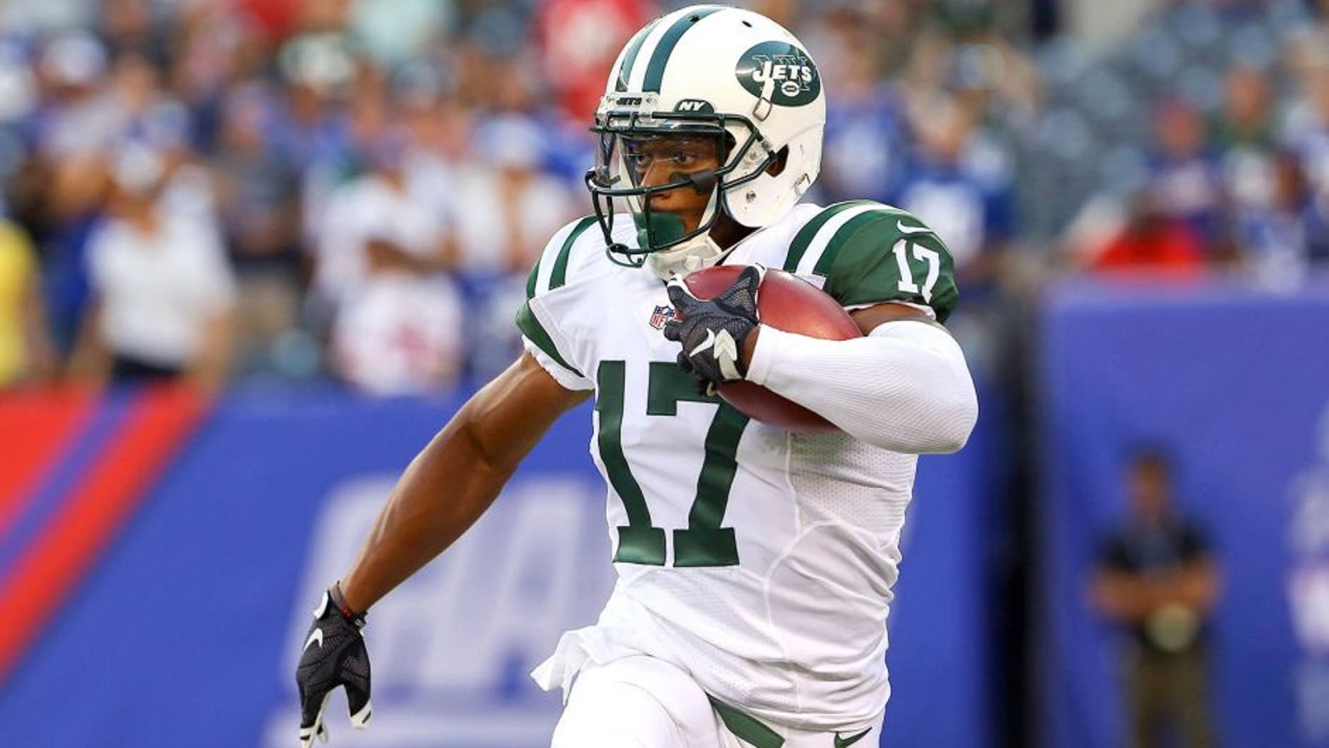 Aug 29, 2015; East Rutherford, NJ, USA; New York Jets wide receiver Chris Owusu (17) returns the opening kickoff during the first half of their game against the New York Giants at MetLife Stadium. Mandatory Credit: Ed Mulholland-USA TODAY Sports