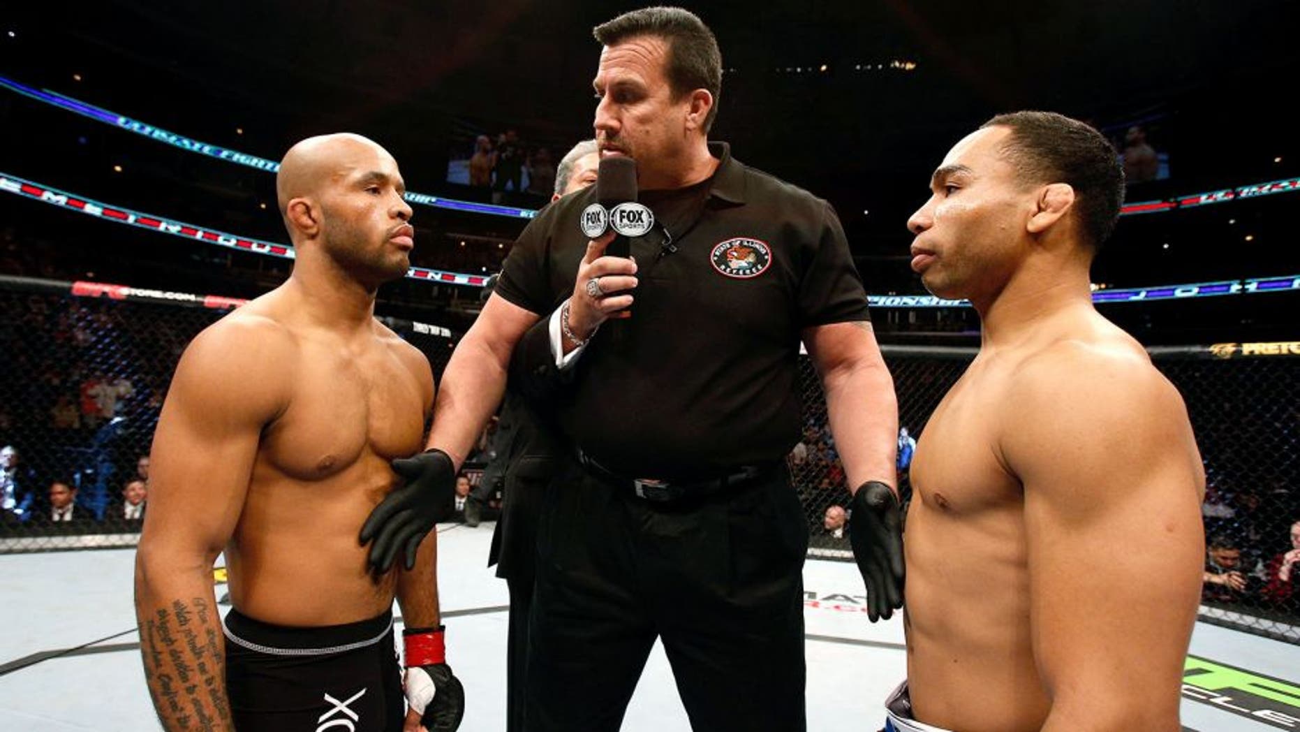 CHICAGO, IL - JANUARY 26: John Dodson (R) face off with Demetrious Johnson (L) during thier Flyweight Championship Bout part of UFC on FOX at United Center on January 26, 2013 in Chicago, Illinois. (Photo by Josh Hedges/Zuffa LLC/Zuffa LLC Via Getty Images)