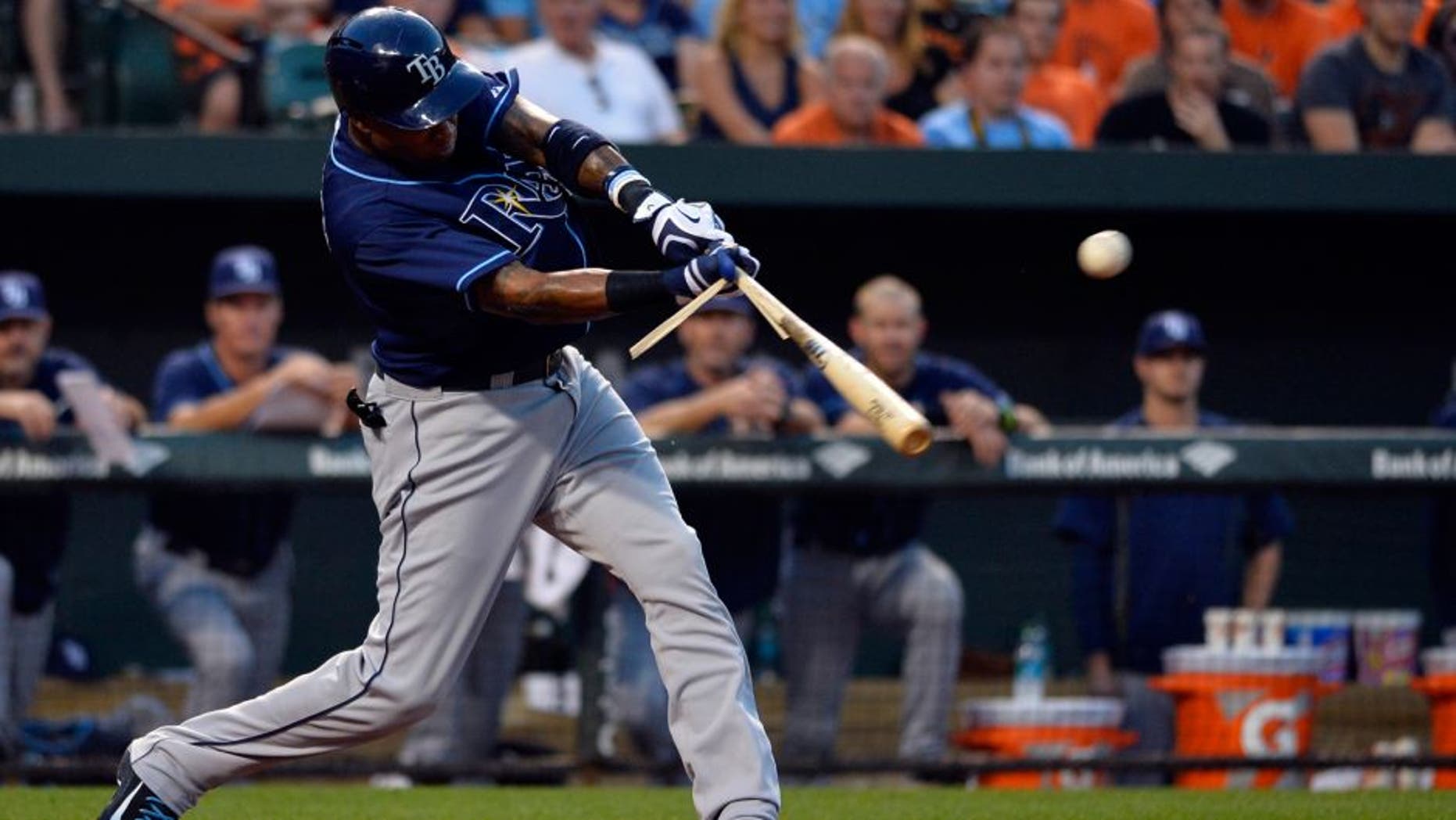 Aug 31, 2015; Baltimore, MD, USA; Tampa Bay Rays designated hitter Tim Beckham (1) hits a sacrifice fly scoring second baseman Logan Forsythe (not pictured) during the second inning against the Baltimore Orioles at Oriole Park at Camden Yards. Mandatory Credit: Tommy Gilligan-USA TODAY Sports