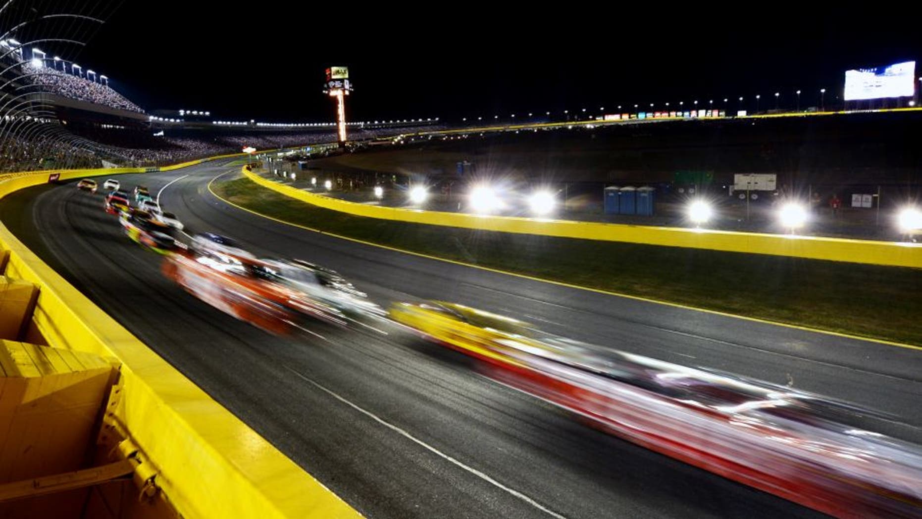 CHARLOTTE, NC - MAY 16: Cars race during the NASCAR Sprint Cup Series Sprint All-Star Race at Charlotte Motor Speedway on May 16, 2015 in Charlotte, North Carolina. (Photo by Drew Hallowell/Getty Images)