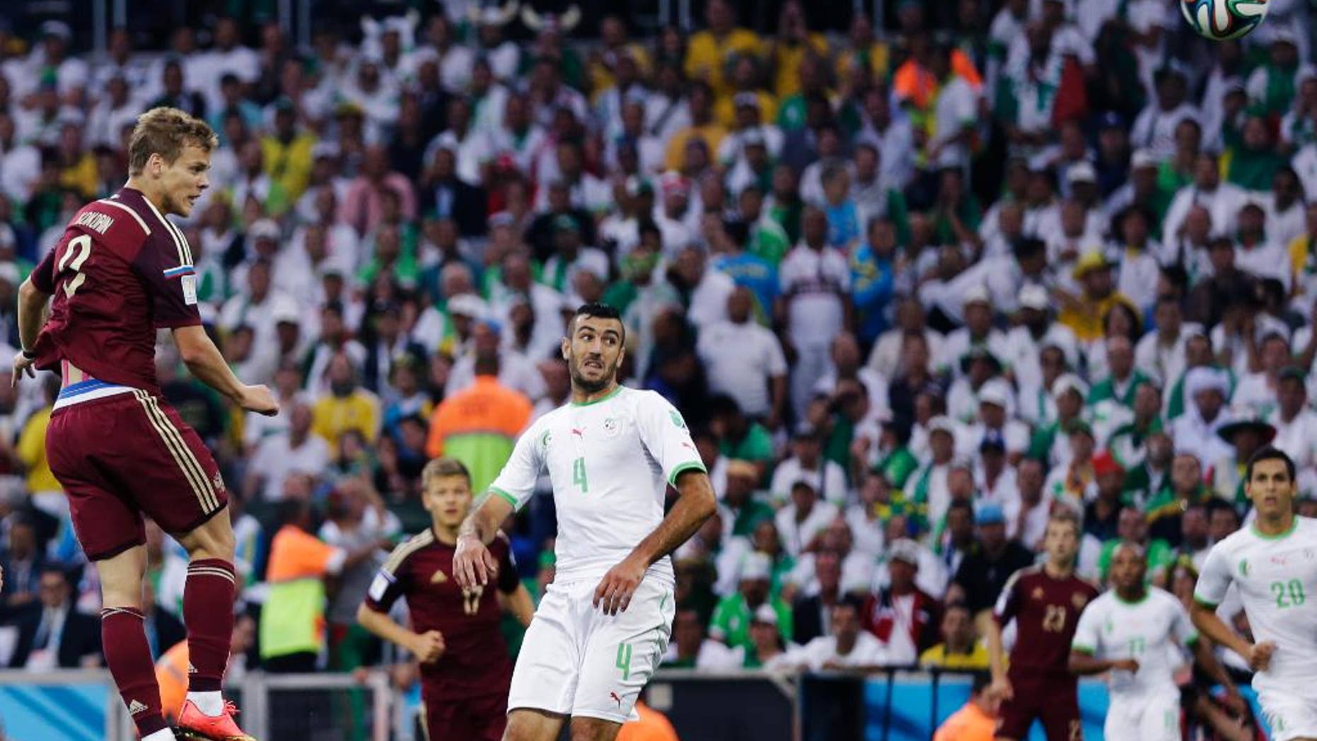 Russia's Alexander Kokorin heads the ball to score during the group H World Cup soccer match between Algeria and Russia at the Arena da Baixada in Curitiba, Brazil, Thursday, June 26, 2014. (AP Photo/Fernando Vergara)