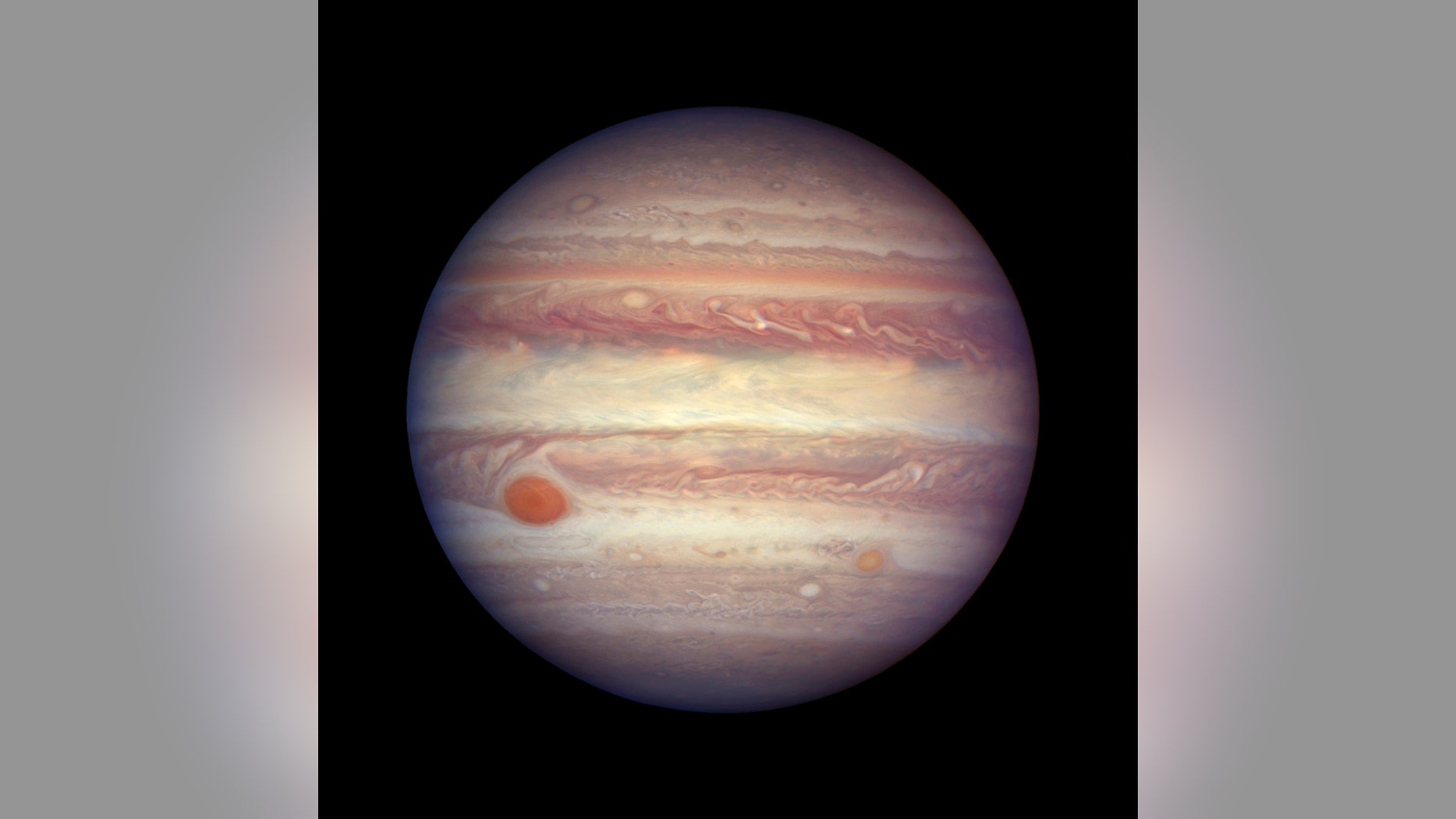 FILE - This April 3, 2017 file image made available by NASA shows the planet Jupiter when it was at a distance of about 668 million kilometers (415 million miles) from Earth. (NASA, ESA, and A. Simon (GSFC) via AP, File)