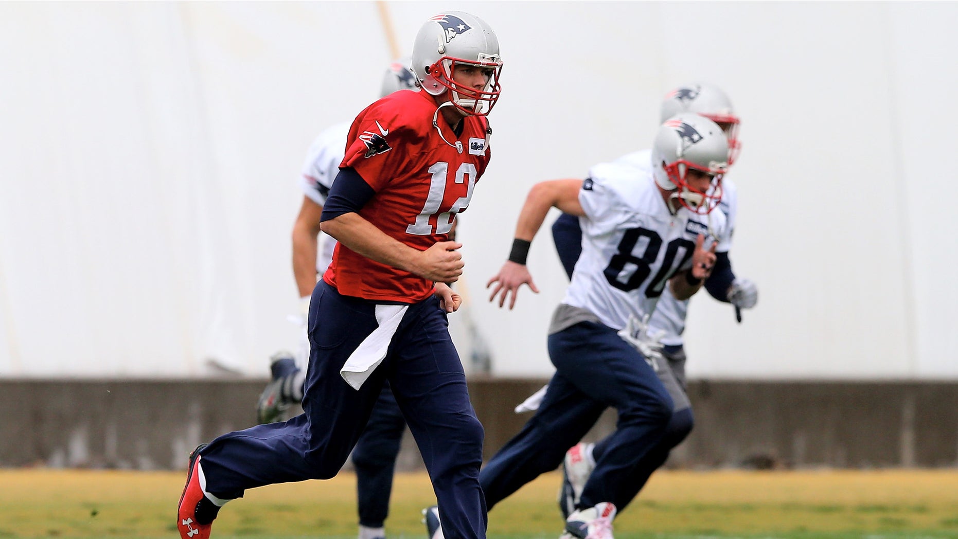 TEMPE, AZ - JANUARY 30: Tom Brady #12 of the New England Patriots warms up during the New England Patriots Super Bowl XLIX Practice on January 30, 2015 at the Arizona Cardinals Practice Facility in Tempe, Arizona. (Photo by Elsa/Getty Images)