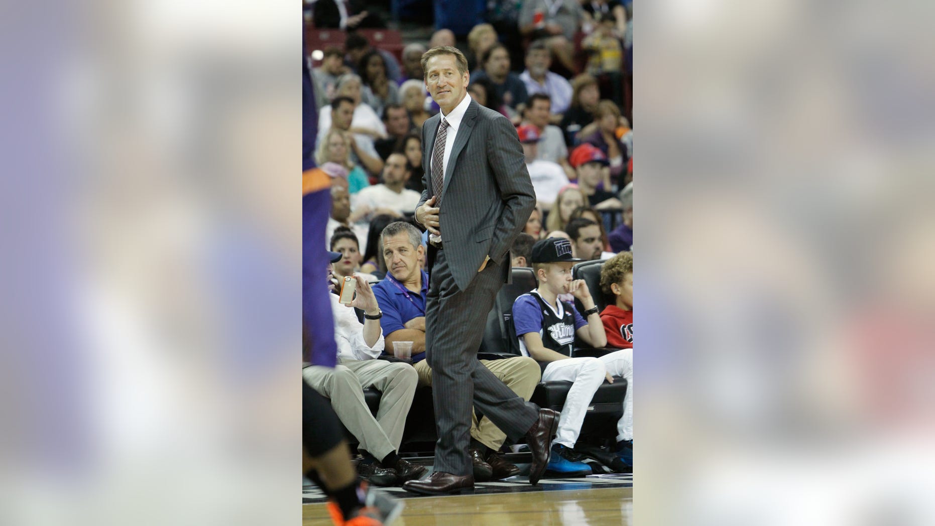 Phoenix Suns head coach Jeff Hornacek walks the sidelines during the third quarter of an NBA preseason basketball game against the Sacramento Kings in Sacramento, Calif., Thursday, Oct. 17, 2013. The Kings won 107-90.(AP Photo/Rich Pedroncelli)