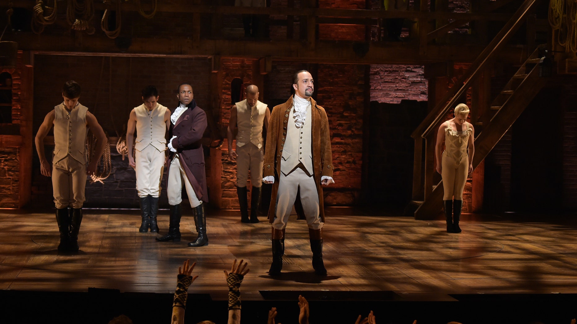 NEW YORK, NY - FEBRUARY 15: Actor Leslie Odom, Jr. (L) and actor, composer Lin-Manuel Miranda (R) perform on stage during "Hamilton" GRAMMY performance for The 58th GRAMMY Awards at Richard Rodgers Theater on February 15, 2016 in New York City. (Photo by Theo Wargo/Getty Images)