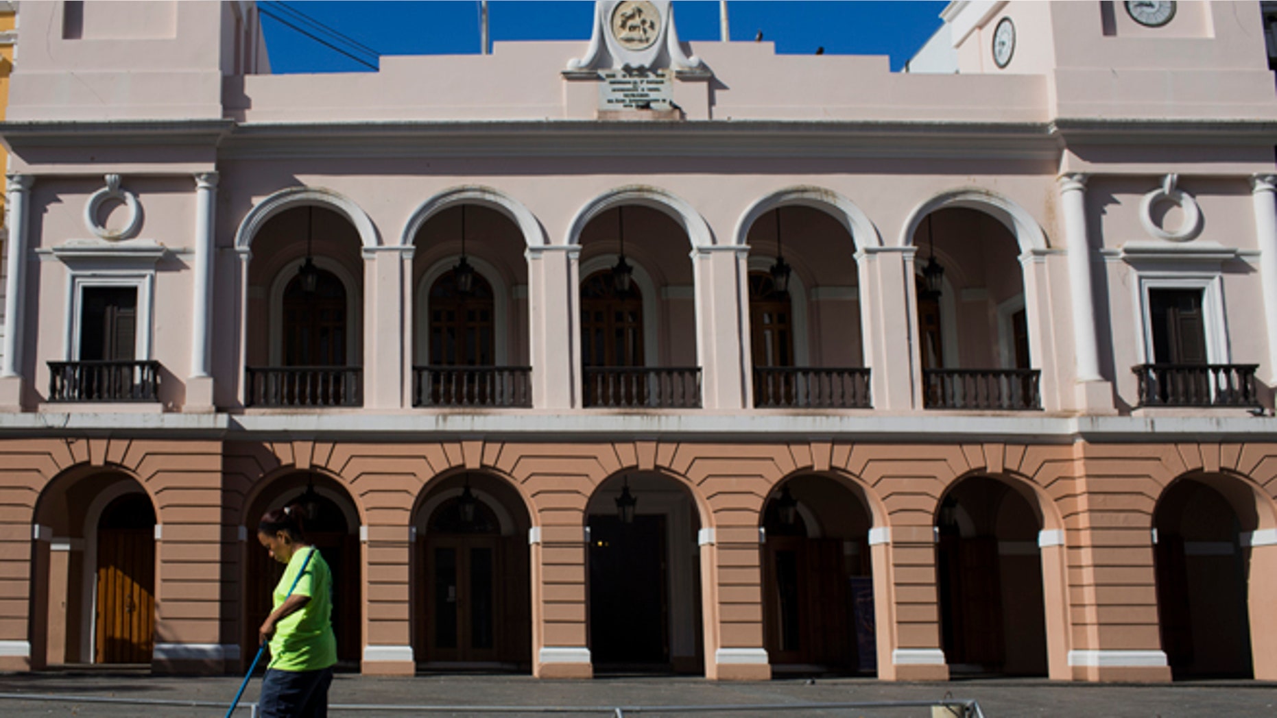 SAN JUAN, PUERTO RICO - NOVEMBER 14: A worker sweeps up litter on November 14, 2013 in San Juan, Puerto Rico. The Government remains the largest employer in Puerto Rico and can only service about 11 percent of the pension costs out of it's budget. The island-territory of the United States is on the brink of a debt crisis as lending has skyrocketed in the last decade with the government issuing municipal bonds mostly to finance pensions. Market analysts have rated those bonds as junk and suspect it's 70 billion dollar debt might be unserviceable in the near future.
(Photo by Christopher Gregory/Getty Images)