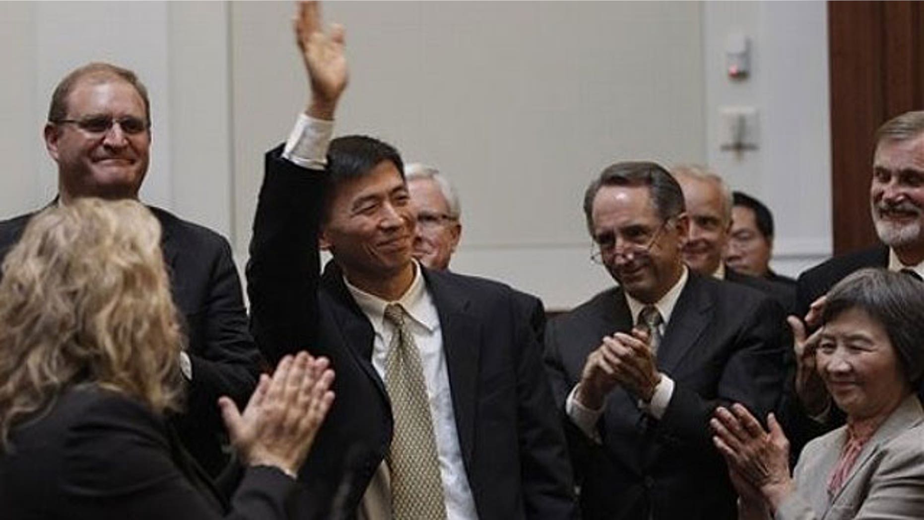 August 31: University of California, Berkeley law professor Goodwin Liu waves after he was confirmed by a three member appointment board of the Commission on Judicial Appointments in San Francisco.