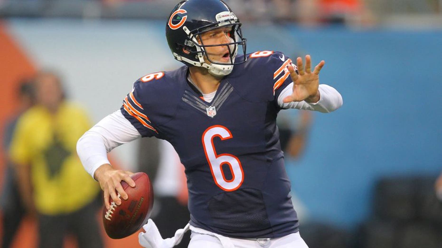 Aug 8, 2014; Chicago, IL, USA; Chicago Bears quarterback Jay Cutler (6) throws a pass during the first quarter of a preseason game against the Philadelphia Eagles at Soldier Field. Mandatory Credit: Dennis Wierzbicki-USA TODAY Sports